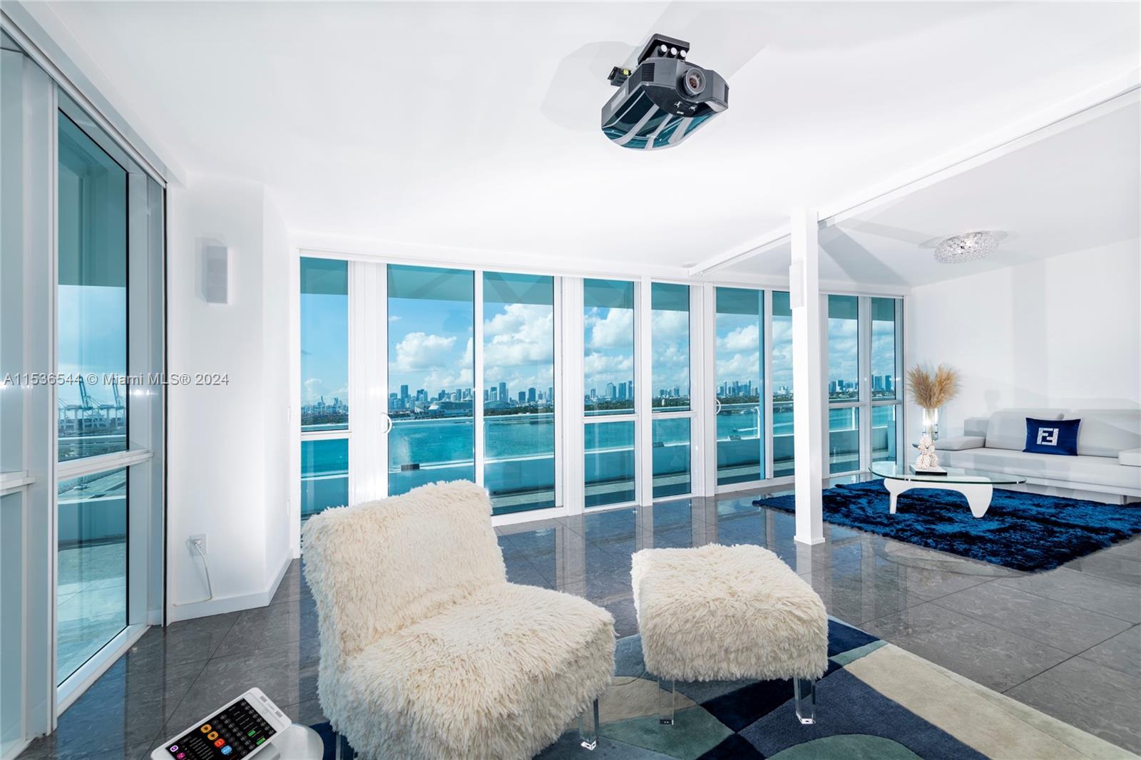 This open floor plan house in the sky located in the heart of south beach offers panoramic 120° wraparound views of the ocean, Miami skyline at the prestigious Bentley bay residences . This one-of-a-kind unit boasts floor-to-ceiling windows, 9 ‘ceilings, state-of-the-art Crestron controlled audio & visual/lighting & shade system & 160’ screen /projector . Gourmet chef's kitchen is complete with top-of-the-line Gaggenau & Sub-Zero appliances.Huge wrap around Corner balconies over 1200 sqft Direct water views/no obstruction Marina downstairs/concierge . Your home and your boat in the same spot..