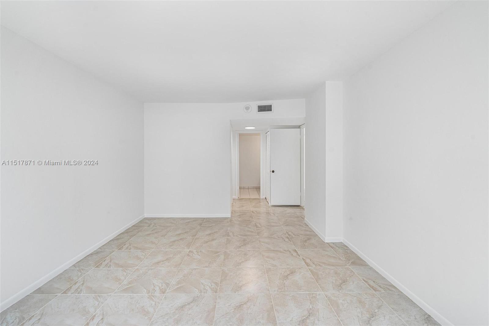 Second Bedroom looking into En Suite Bathroom. Walk-in Closet on Left