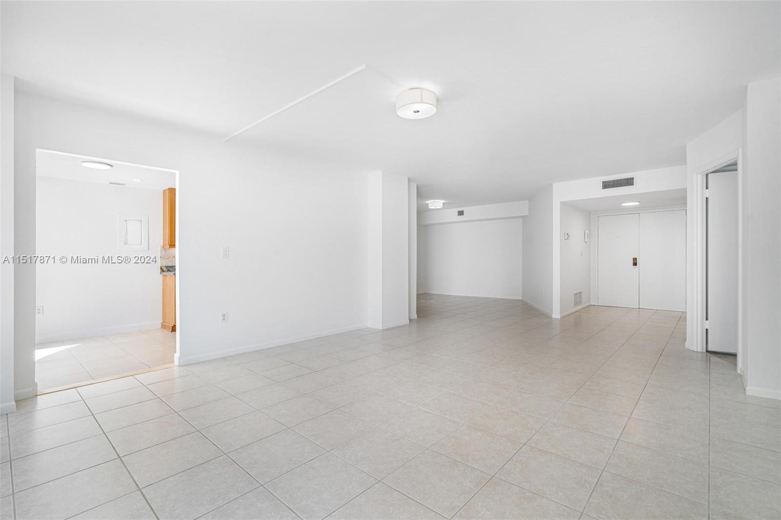 Living Room looking into Kitchen, Dining and Entry