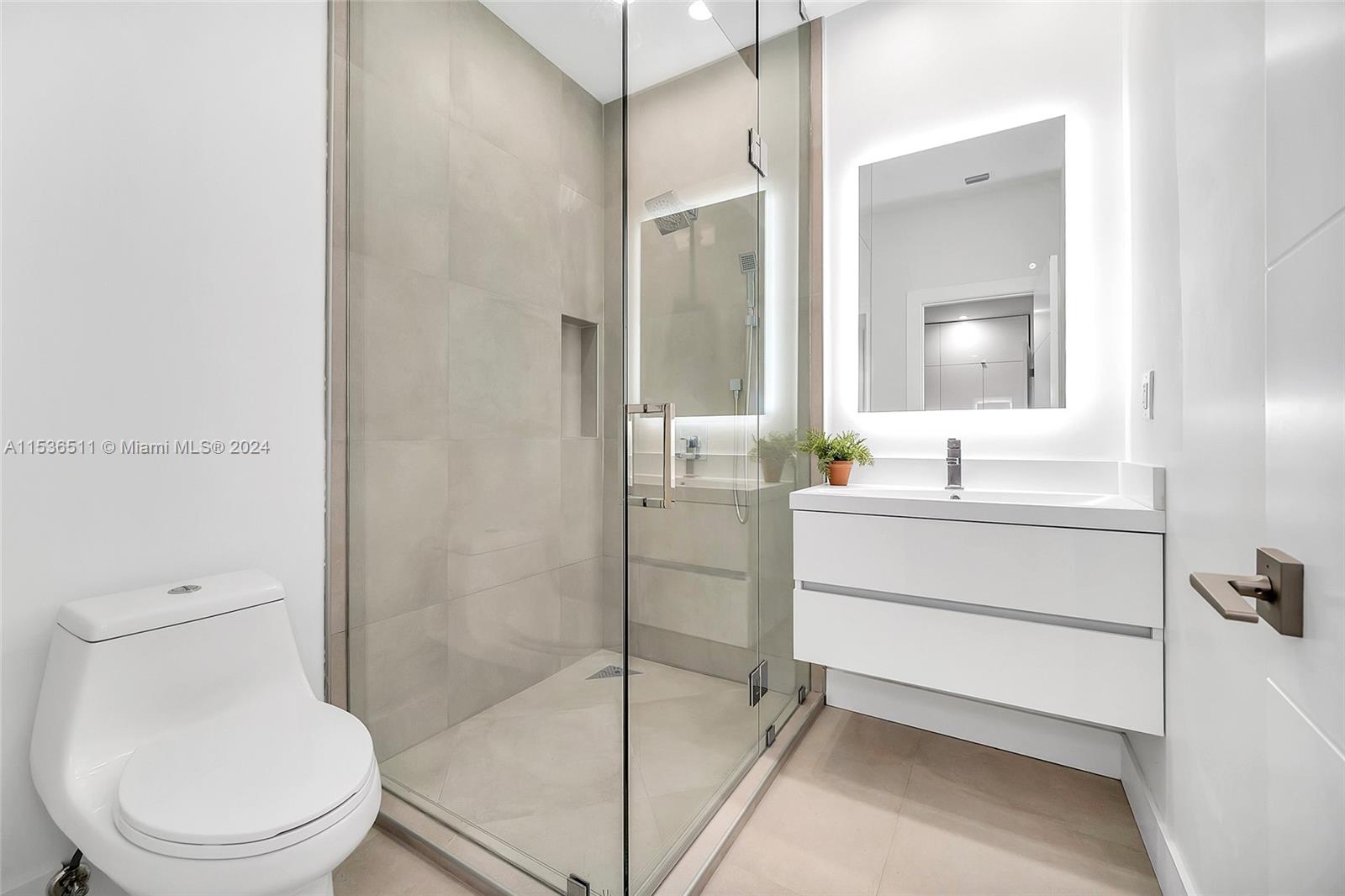 Main bedroom with generous his and hers walking closets