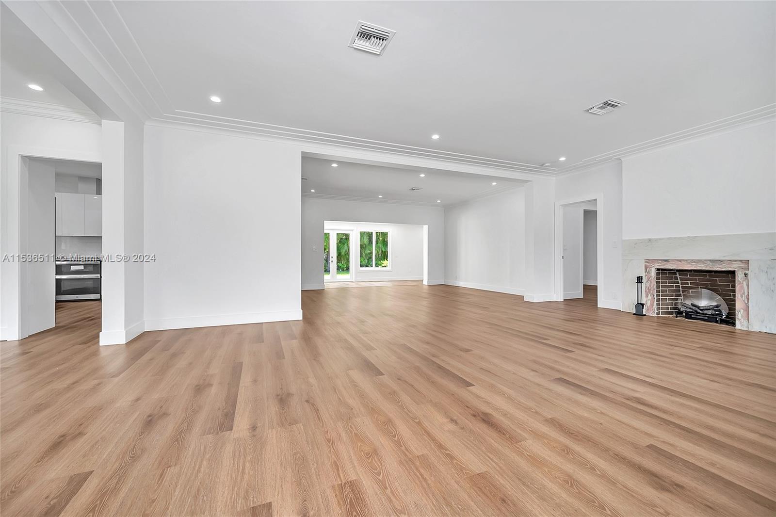 Gorgeous wood flooring runs throughout this wonderful home