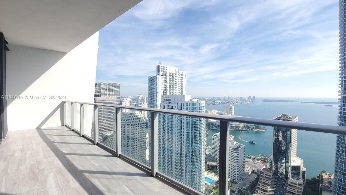 FULLY FURNISHED upgraded condo at the iconic 1010 Brickell. AVAIL May 1st, 2024. Professionally furnished unit has 2 beds, 3 baths, private elevator, family room + living room,  11-foot ceiling height, electric shades,  huge balcony with stunning views +  private balcony for master bedroom.  Building Amenities -  rooftop swimming pool/hot tub & restaurant/bar on the 50th floor,  outdoor movie theater, unisex Hammam spa with cold plunge pool & indoor hot tub, massage rooms, sauna & steam room, indoor basketball court, racquetball court, running track, heated indoor swimming pool, large fitness center with separate yoga/class studio room, club room w kitchen, kids game room with bowling, virtual golf and more.  Excellent Location.** AVAILABLE May 1st, 2024**