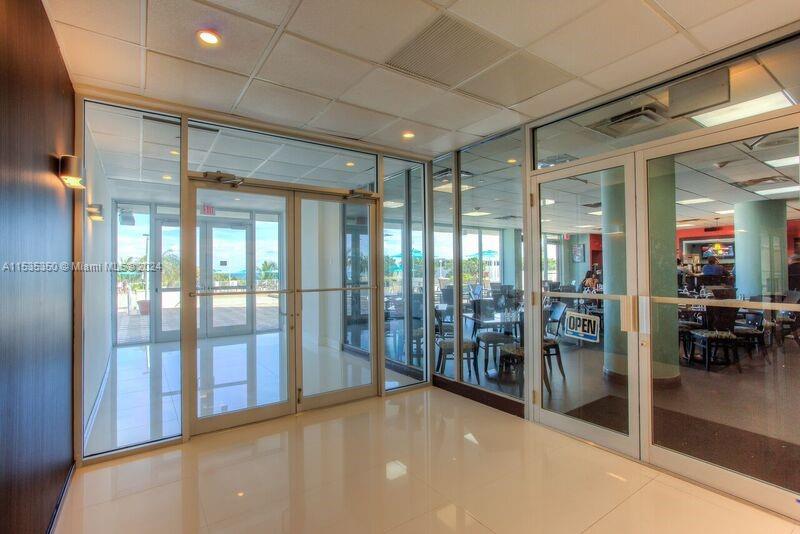 EXIT TO THE POOL AND BEACH AREA