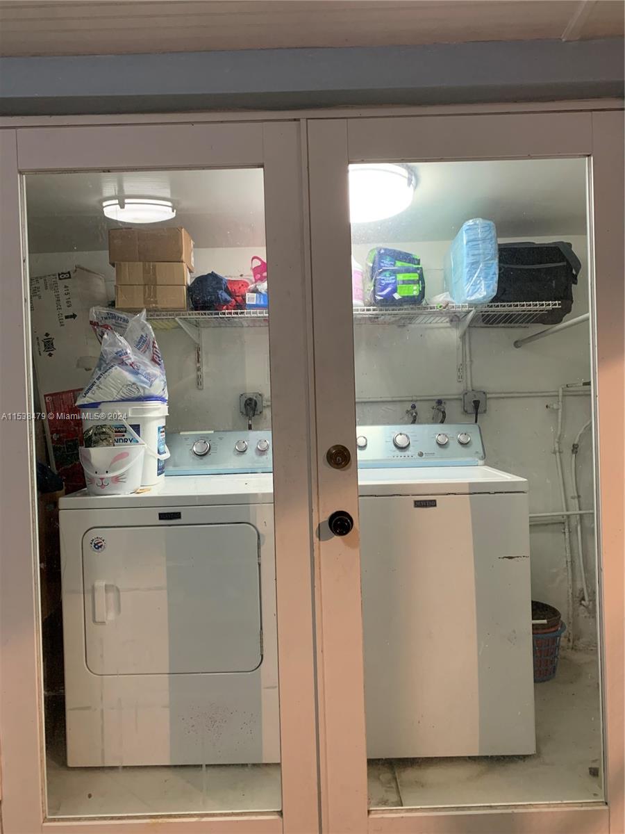 Laundry room with french doors front the patio(entertainment space) enclosed with roof attach of the house.