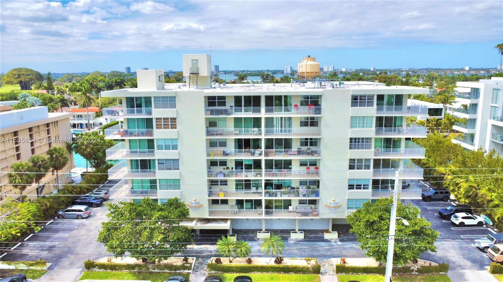 Nestled in the heart of Bay Harbor Islands! 1-bedroom, 1.5-bathroom haven bathed in natural light. With 1000 sq/ ft. of space, this charming condo welcomes you with open arms. Step onto the wrap-around balcony and breathe in the fresh air as you bask in the partial water view. Convenience is at your doorstep, with a top grade school just across the street and the shimmering shores of the beaches mere minutes away. Retail therapy awaits at the nearby shopping stores, including the renowned Bal Harbour shops. This unit offers a new AC in 2023 and a fresh water heater, this home also boasts assigned parking for your convenience. This unit offers a canvas for you to unleash your creativity and make it your own slice of paradise.