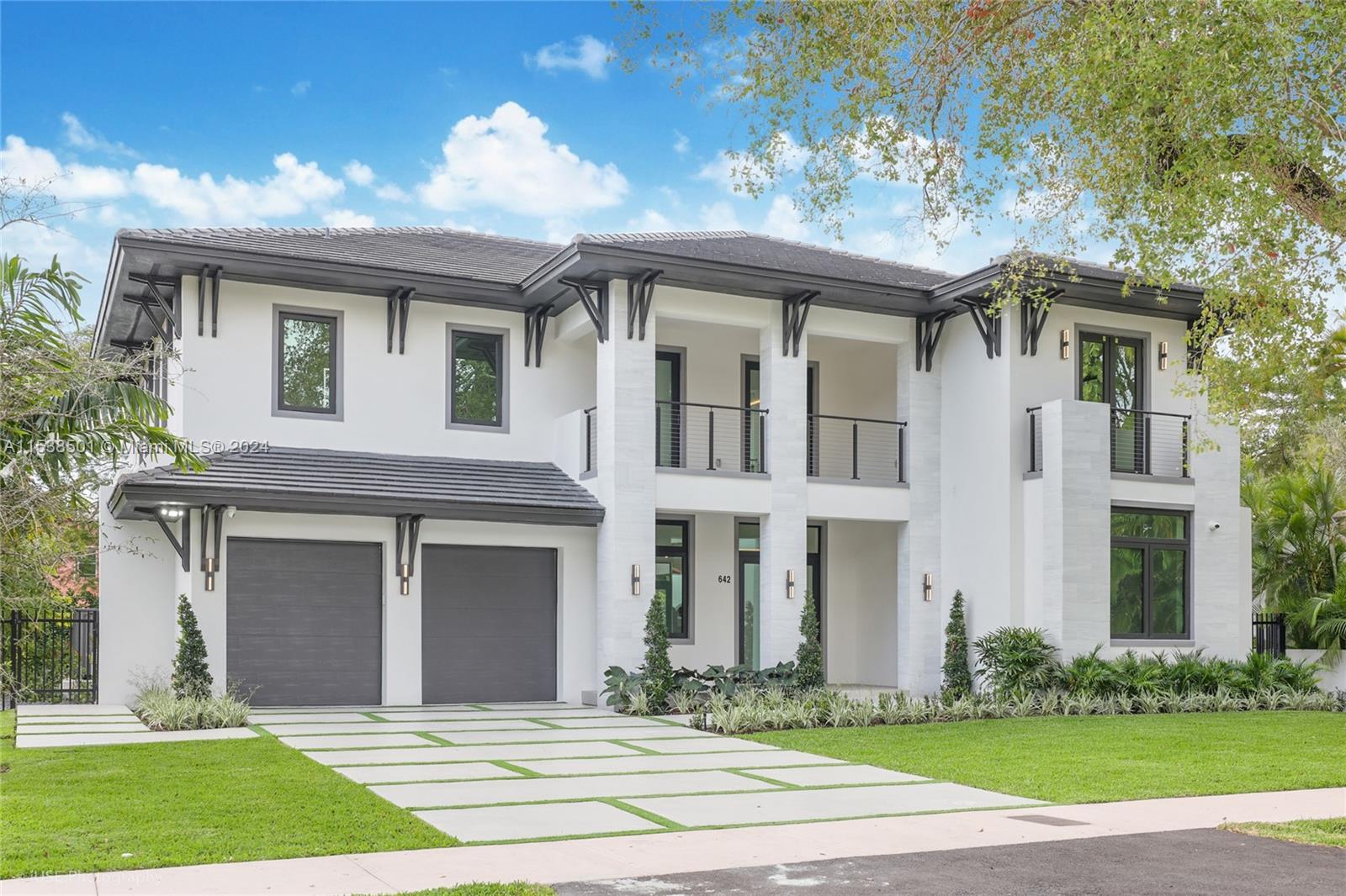 Ready for move in! Brand new transitional-style executive home within walking distance from Granada Golf Course, Miracle Mile and Downtown Coral Gables. House is on a double lot and features 5 bedrooms, including one on the ground floor, 6 bathrooms, 2 car garage, ample yard and pool. Oversized primary w/ 2 walk-in and large spa bath. Top of the line European kitchen cabinets and appliances including Wolf oven, speed oven, and electric range. A laundry on each floor. Large format porcelain and wood floors. Prewired for entertainment and security system, floating staircase with architectural glass railing. Top of the line impact windows and doors with Solarban 70 High Performing Low E Glass. Connected to the sewer system and Municipal water. See attached floorplans/specs.