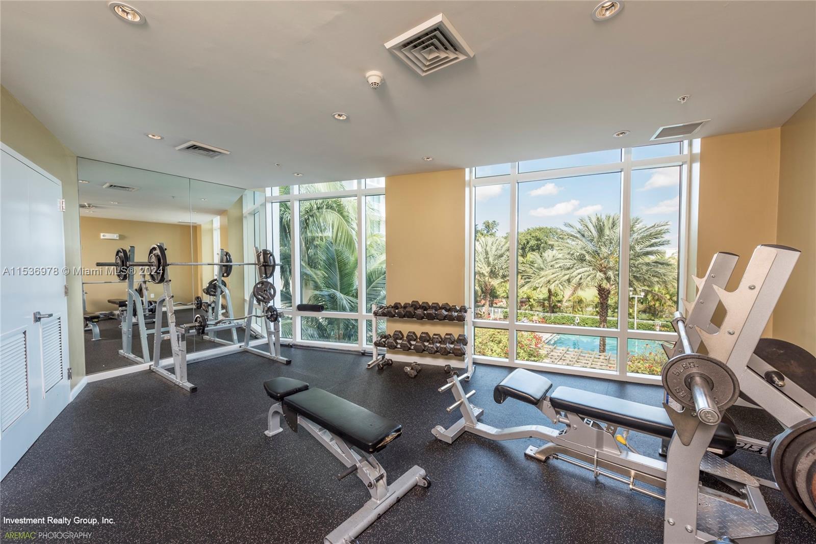 eautiful fitness center facing the pool and golf course