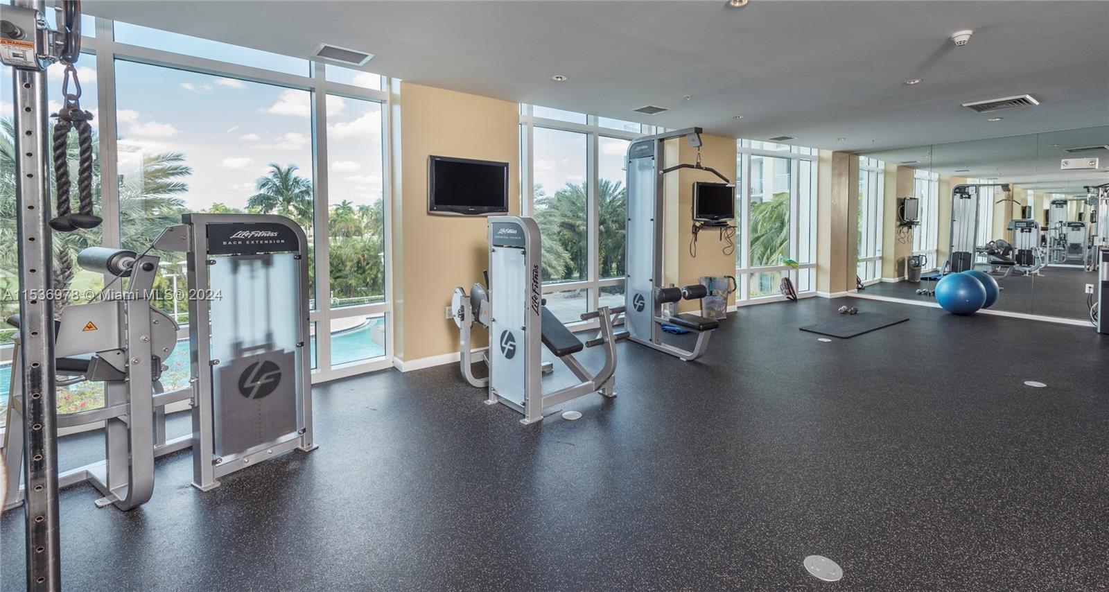 Beautiful fitness center facing the pool and golf course