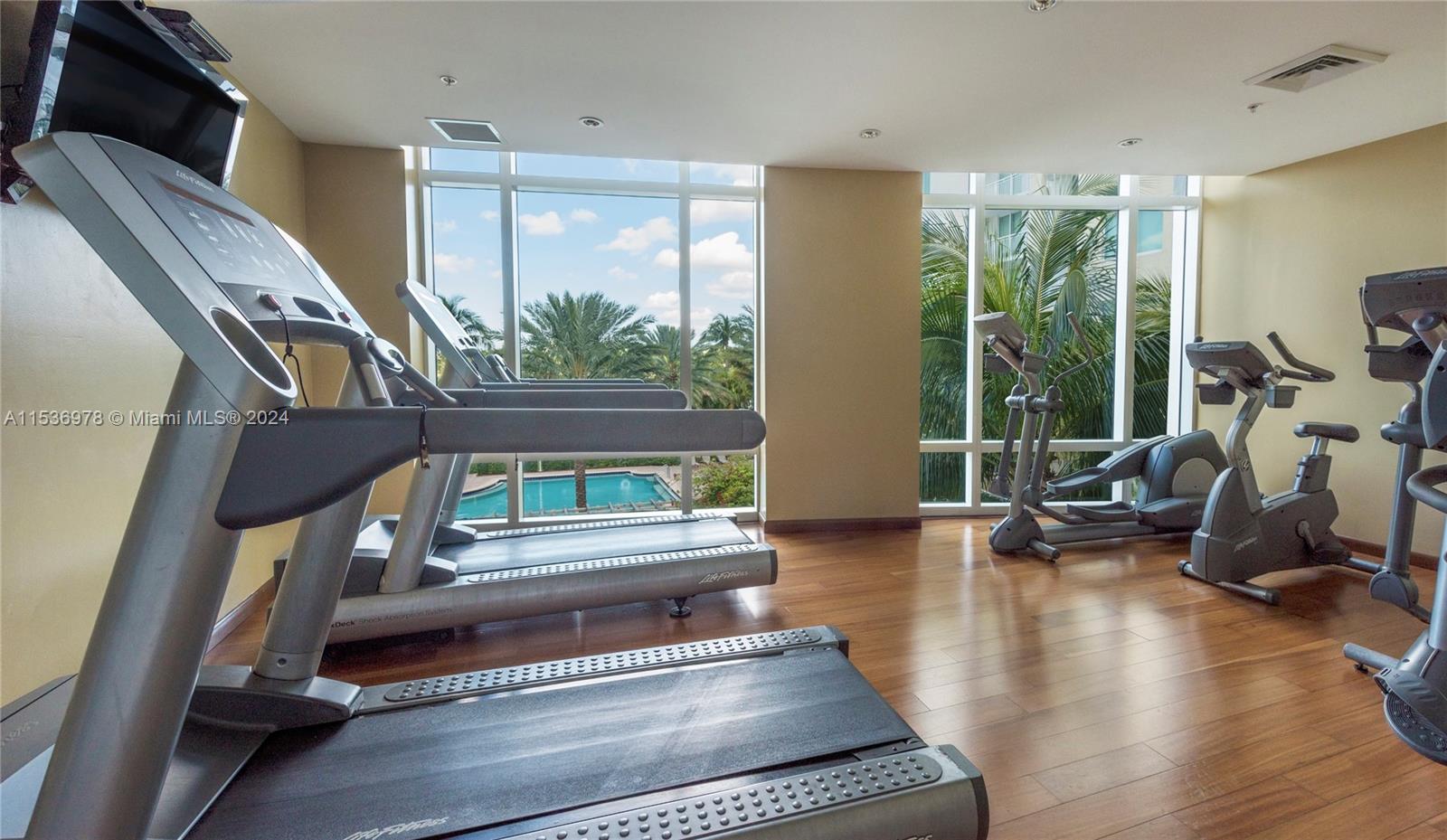 Beautiful fitness center facing the pool and golf course