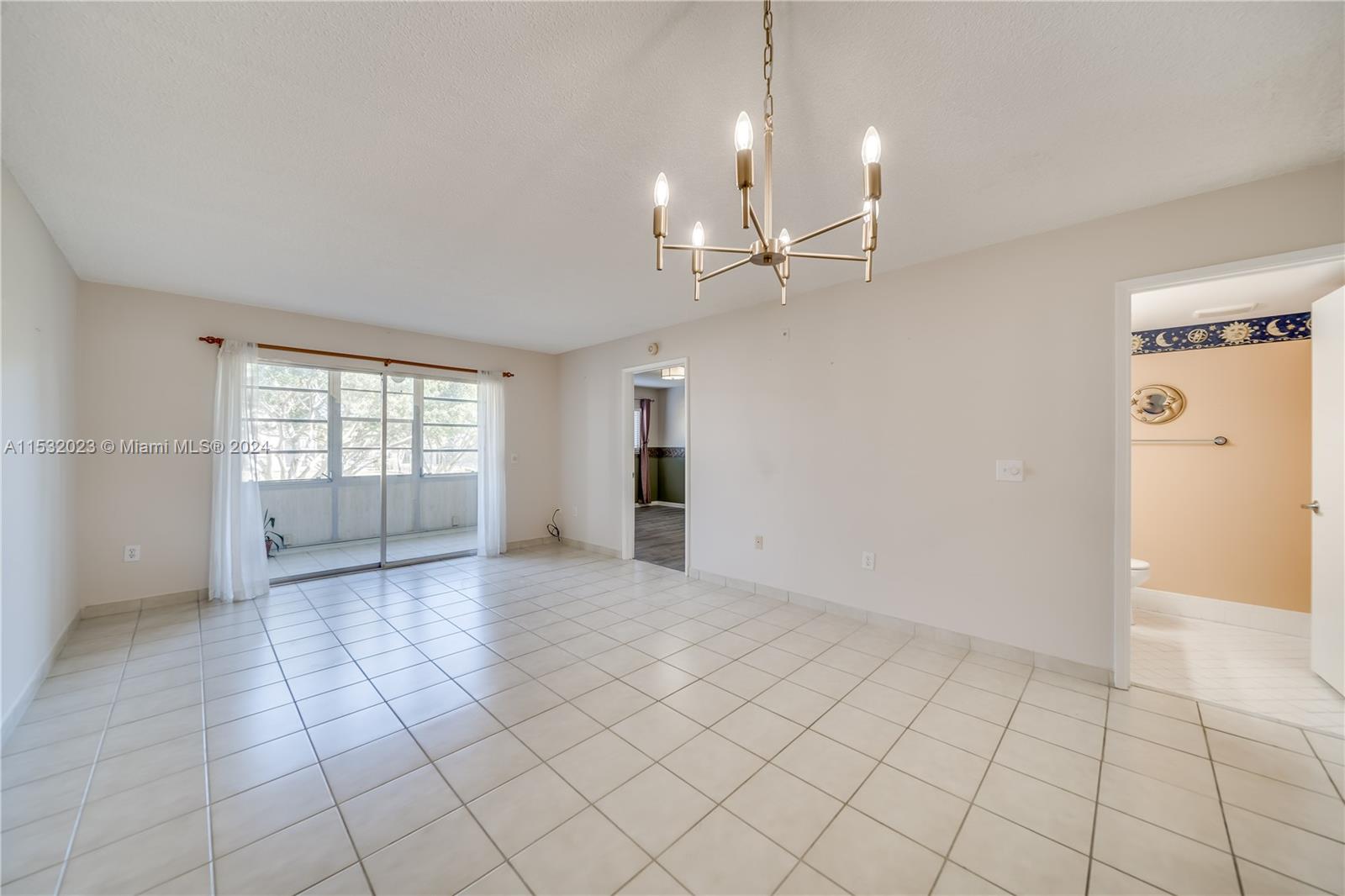 Left to Right: Half bath, Hallway & Pass through to kitchen