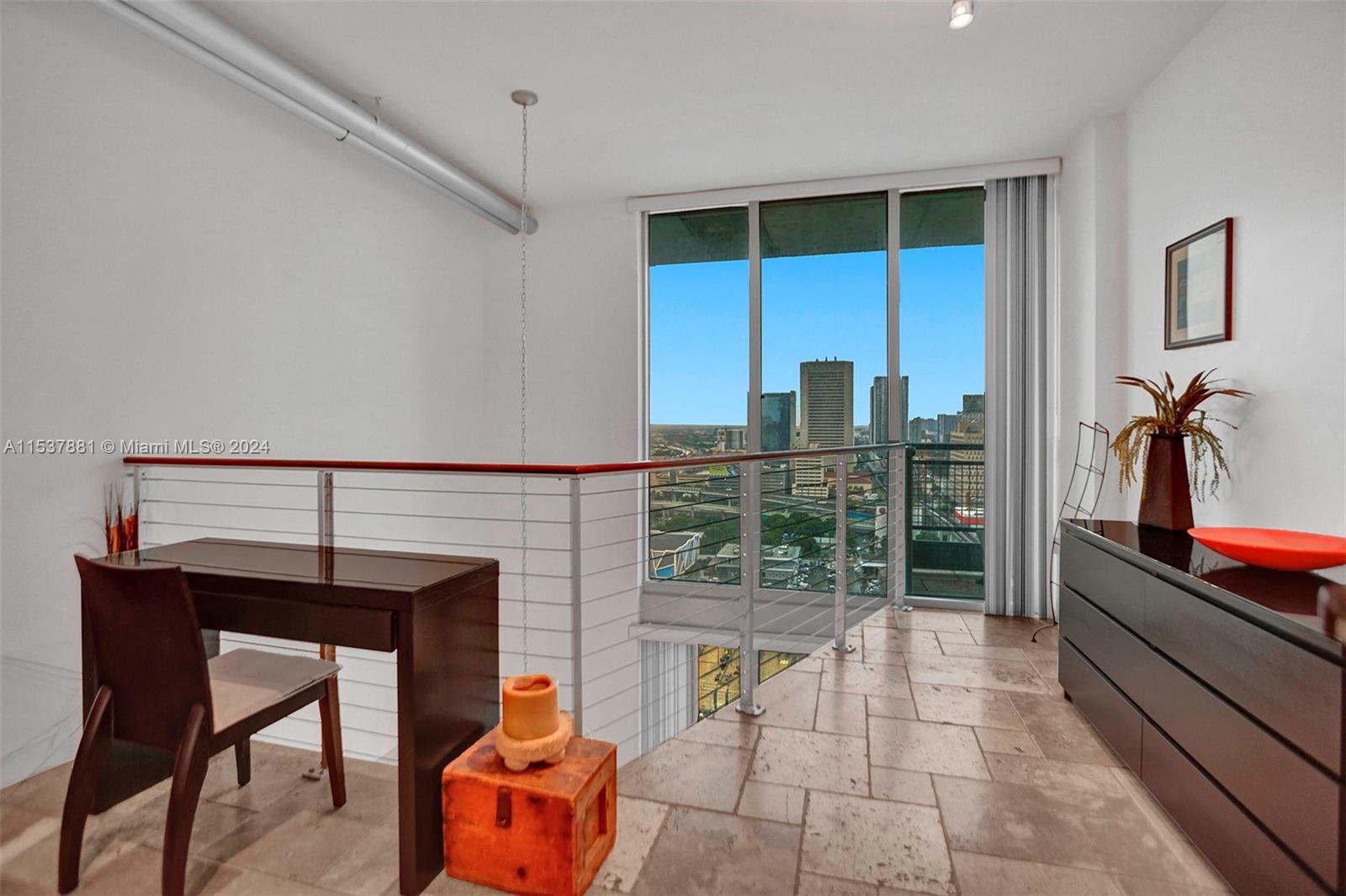 Bedroom has a small balcony.