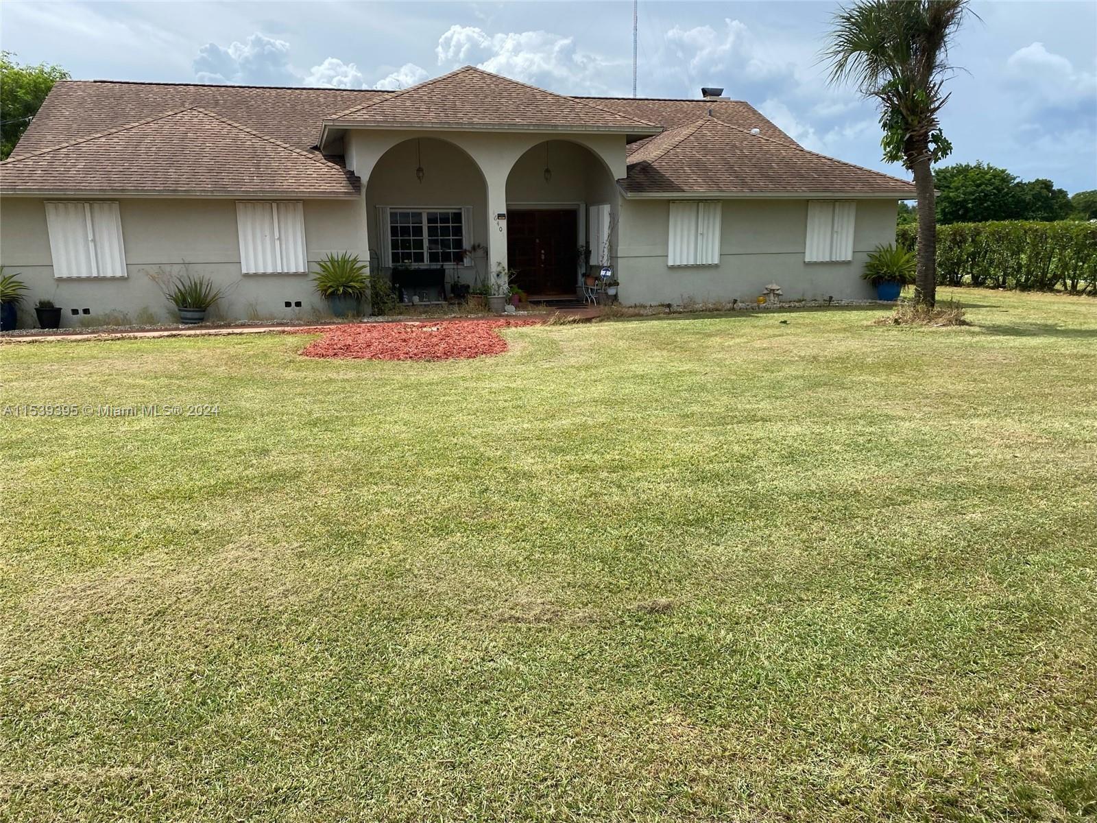 Escape the City! Charming Redland 3/2 Ranch on almost an acre lot (.92 acre) with 6' chain link fenced in backyard with 2 gates and privacy hedges. Recently replaced A/C and roof. Home faces east and does not sit on SW 248th Street. 2,051 sq. ft under A/C, 429 sq. ft covered patio and 437 sq. ft. 2 car garage. Plenty of space for your boat, travel trailer or RV. Short walk to Redland Elementary/Middle School and Knaus’s Berry Farm home of the South Florida famous cinnamon rolls. 7 minute drive to Walmart Neighborhood Market, 13 minute drive to Publix, 13 minutes to shopping at Homestead Pavilion and area restaurants.