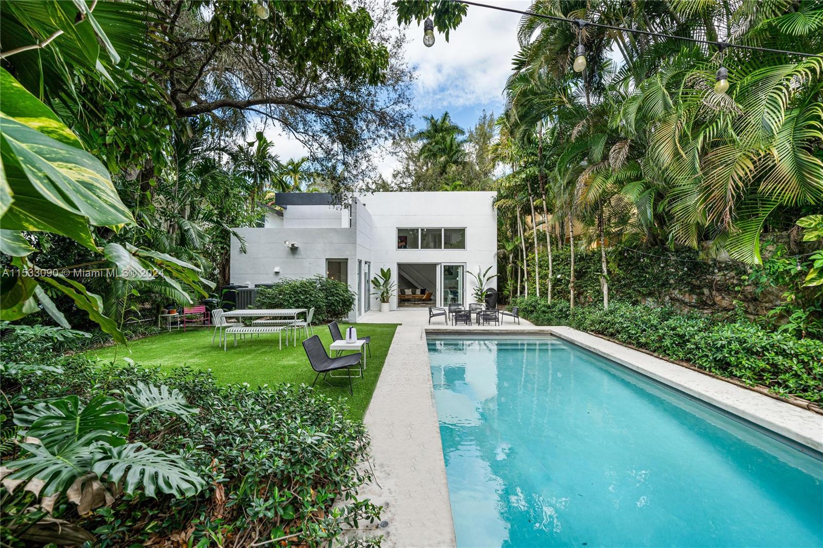 Seize the opportunity to reside in the sought-after South Coconut Grove! Designed by the awarded architect Roney Mateu, this home stands as a contemporary design masterpiece, featuring chic and minimalist aesthetics. The residence is bathed in light, offering expansive views of lush vegetation. Its layout ensures tranquility and privacy. The house offers 3 bedrooms,3 bathrooms, a family room, an office easily convertible to a bedroom, and a two-car garage. High ceilings and generous interiors, together with the meticulously maintained grounds and a pool, establish this jewel as a haven of luxury and style. Situated just a short distance from the Village, with its boutiques, restaurants, and some of the best schools. Only minutes away from marinas, MIA airport, Brickell, and the beaches.