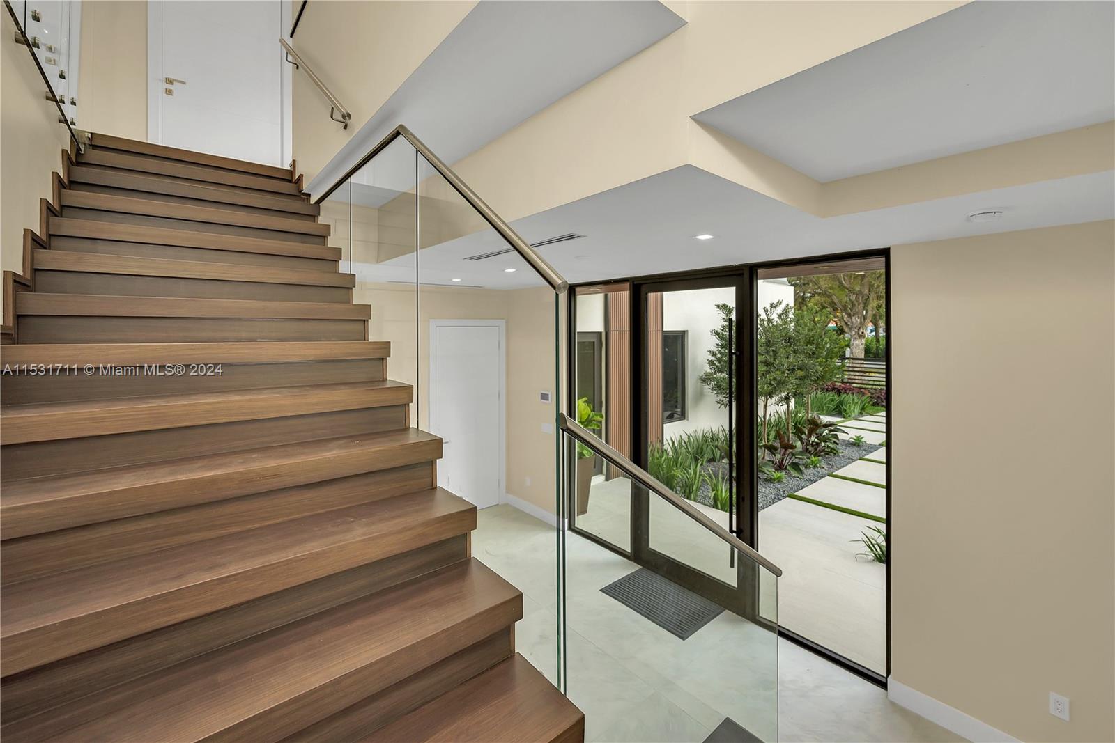 Staircase leading to Elevator door & Landing