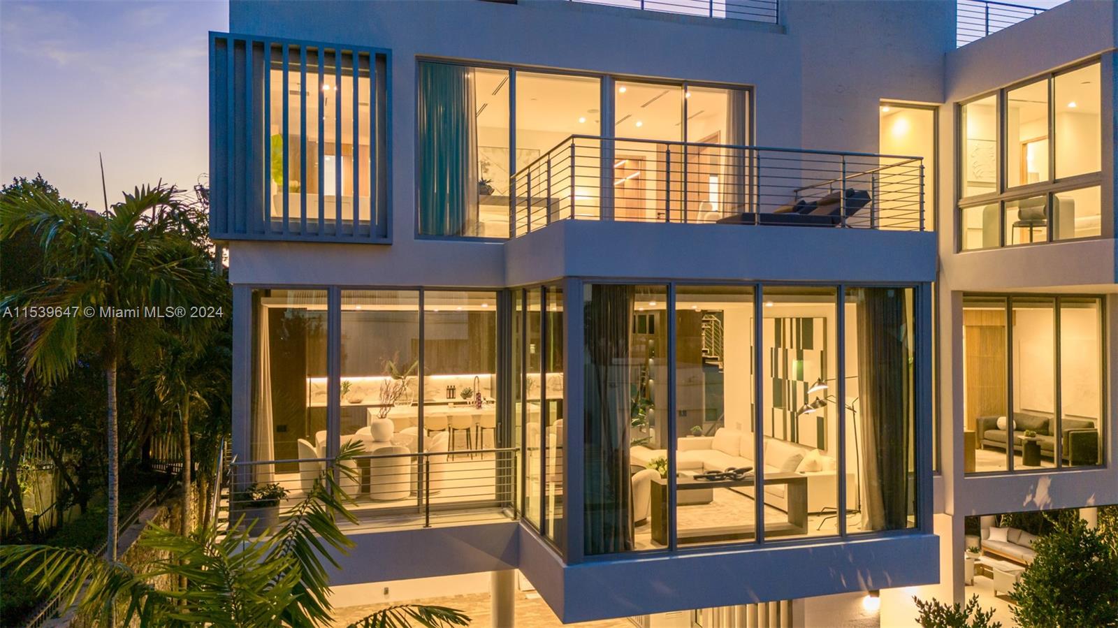 Close-up of kitchen on 2nd level and primary bedroom on 3rd level