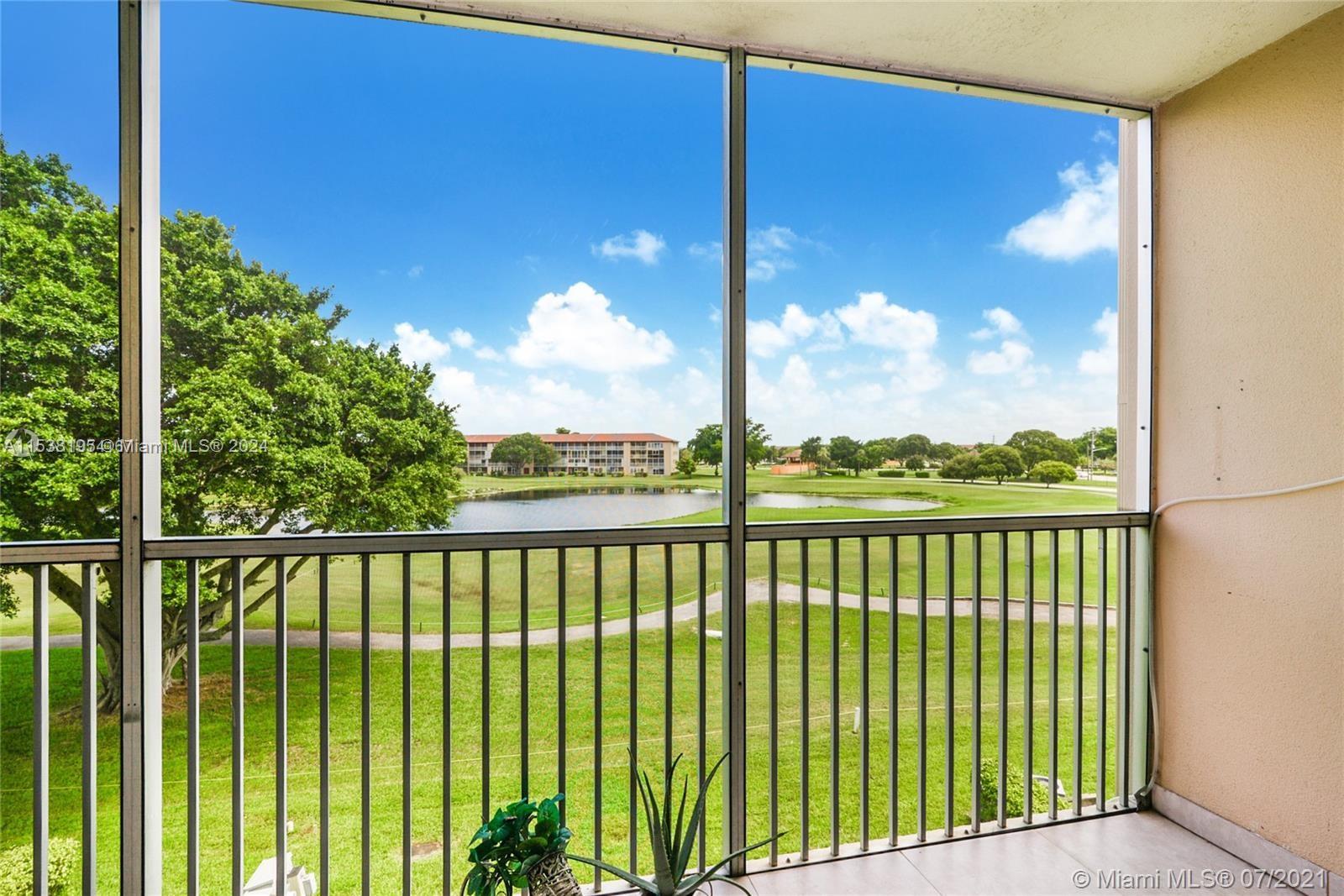 balcony located in the room with lake and golf view