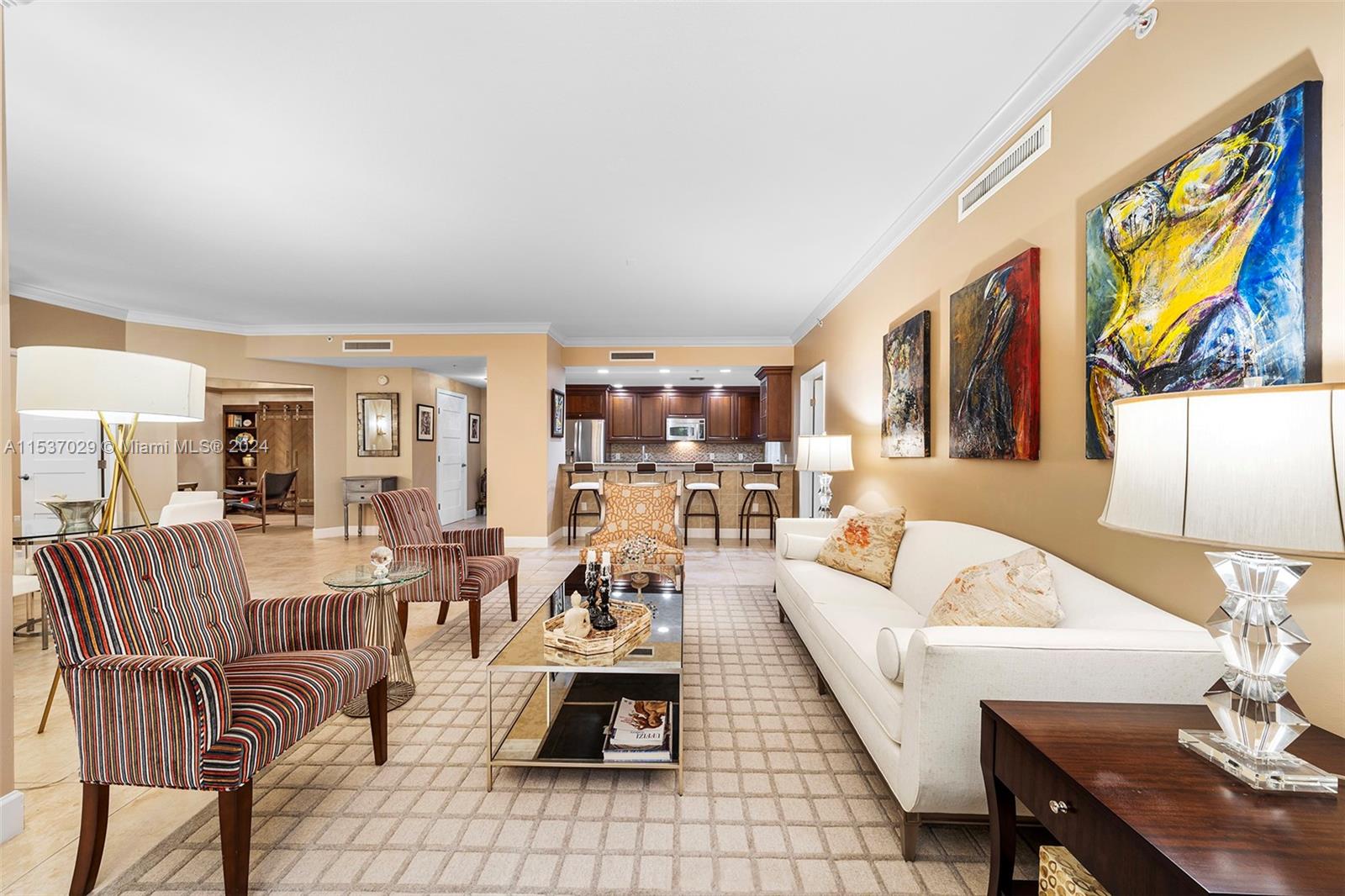 Right in the heart of vibrant downtown Coral Gables sits this oversized impeccably maintained crisp and inviting condo. With 3 beds/3.5 baths PLUS a den/office, this double unit offers a smart and open layout with split floor plan, two primary suites, volume ceilings, impact glass, and dual balconies overlooking lush greenery and soothing fountains. This unit comes with 3 parking spaces (2 assigned) and building amenities include fitness room, 24-hr security, secured lobby with doorman, club room, and billiard room. The perfect combination of your own private retreat amidst a bustling cityscape just steps from Miracle Mile!