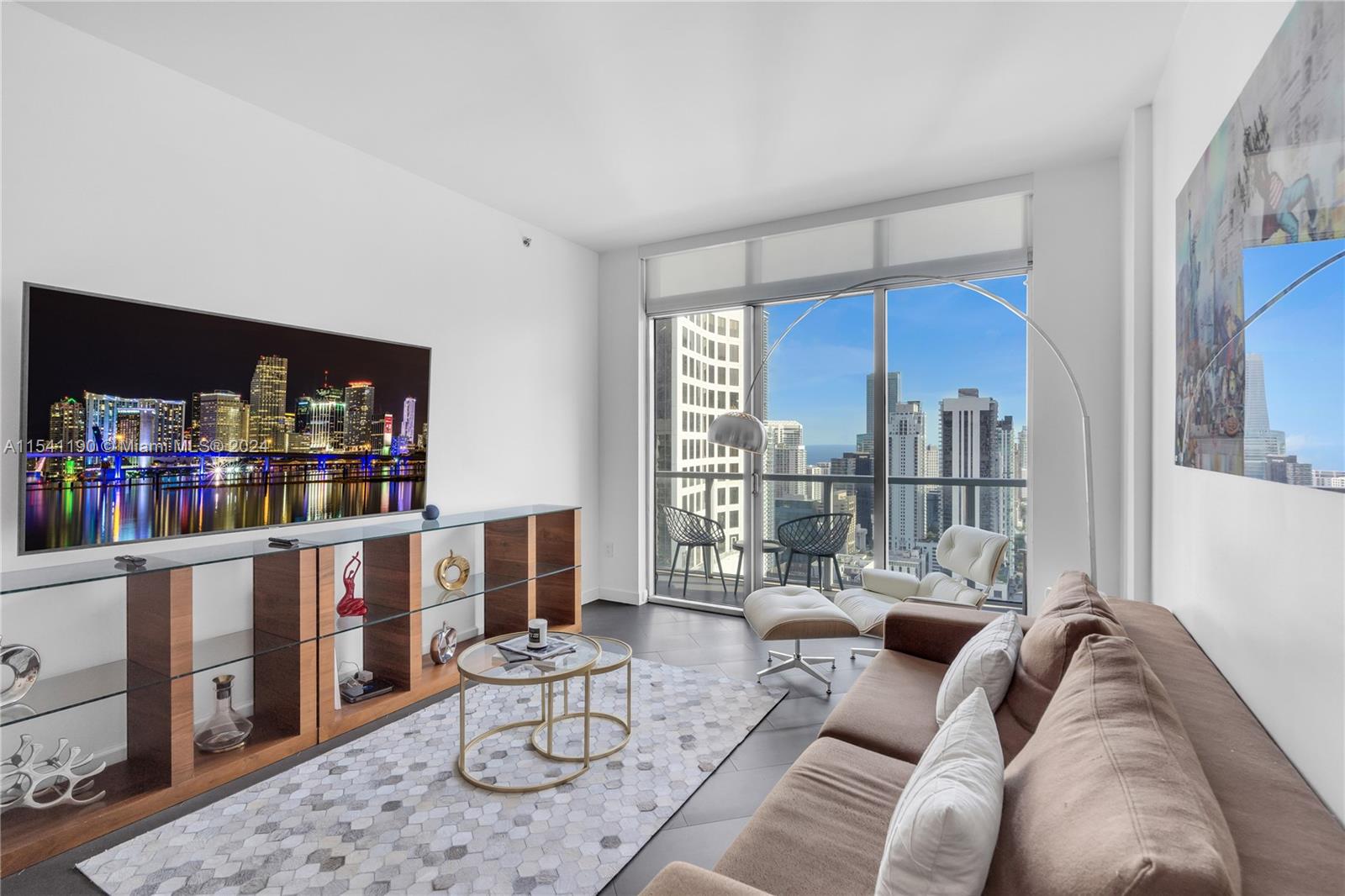Enjoy luxury living at its finest in this fully furnished penthouse on the 43rd floor in the heart of Brickell. Italian designer finishes, new Samsung smart TVs, Alexa, and robotic vacuum, fully equipped kitchen and beautiful art. High speed WiFi and cable is included. This penthouse is also available for 6 month lease, making this an ideal option of a luxurious and comfortable short term stay. The high-end furnishings, volume ceilings and stunning views make this penthouse a unique and desirable option. The building offers two pools, on the 11th floor and the rooftop, jacuzzi, state-of-the-art gym, party room, movie theater, 24/7 security, attended lobby and valet service. One assigned parking space on the 3rd floor. One block from Brickell City Center, five star restaurants and much more
