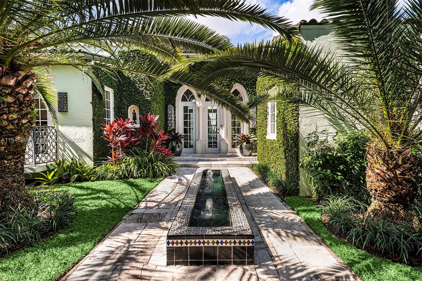 This distinctive residence in Coral Gables offers an array of upgrades, exquisite details, and designer touches, complemented by soaring ceilings. Upon entering, the vaulted ceiling in the foyer immediately captures attention, hinting at the grandeur within. Flooded with natural light, the living spaces, including a home library and spacious bedrooms with custom closets, are enhanced by floor-to-ceiling impact windows and elegant French doors. The master bedroom boasts a cozy seating area, a custom walk-in closet, and a luxurious master bath featuring a steam shower. A private terrace off the master bedroom, embellished with marble pavers. Additionally, a detached den, gym or home office adjacent to the back terrace offers flexibility and privacy.