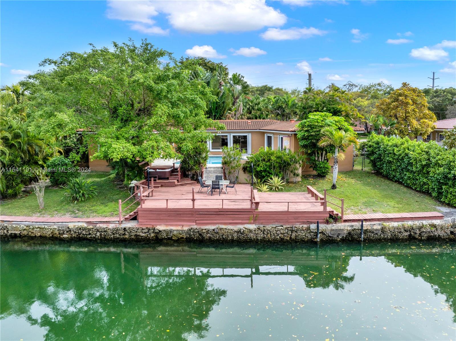 Nestled in Coral Gables, the City Beautiful, this 4/4 home is a true gem, offering waterfront living with a distinctive heart-shaped pool. Perfectly positioned near US1, it provides convenient access to the University of Miami, top-rated schools, Whole Foods, and Miami International Airport. Updated in 2017 with a new roof and a kitchen refresh in 2005, this residence combines comfort with charm. The private deck and recently maintained seawall further elevate the outdoor living experience, making this property not just a home but a sanctuary in one of South Florida's most sought-after locations.