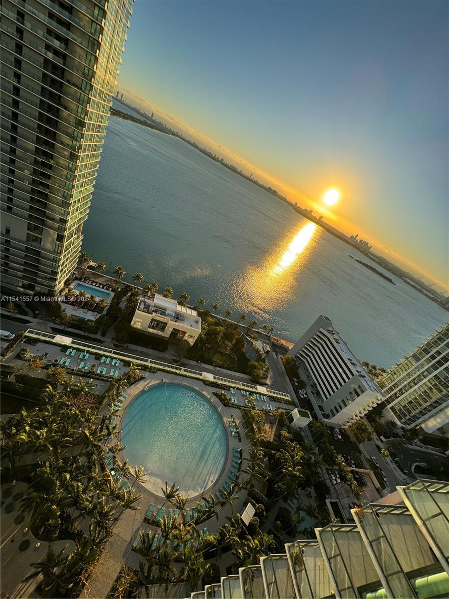 Experience comfort & luxury in this corner condo at Paraiso Bay, featuring 1 bed+DEN/2 full baths. Enjoy 898 SQ FT of mesmerizing Miami skyline and ocean/bay views from all angles. Dive into a world of upscale amenities including state-of-the-art fitness center, bowling alley, golf simulator, putting rink,  100 ft. diameter "lagoon" pool w/cabanas, 2-tennis courts, theater & cigar rooms, business center, study room, wine cellar, spa, massage rooms, kids room, yoga/pilates studio, BBQ zone, 1-car garage, impact windows & doors throughout, 24-hr Concierge/valet service.....Conveniently located: close to Design District, Wynwood, Miami Beach and minutes away from Miami International Airport!!.........Unit is vacant/Easy to show......CHECK OUT MY VIRTUAL TOUR.......schedule your visit today!.