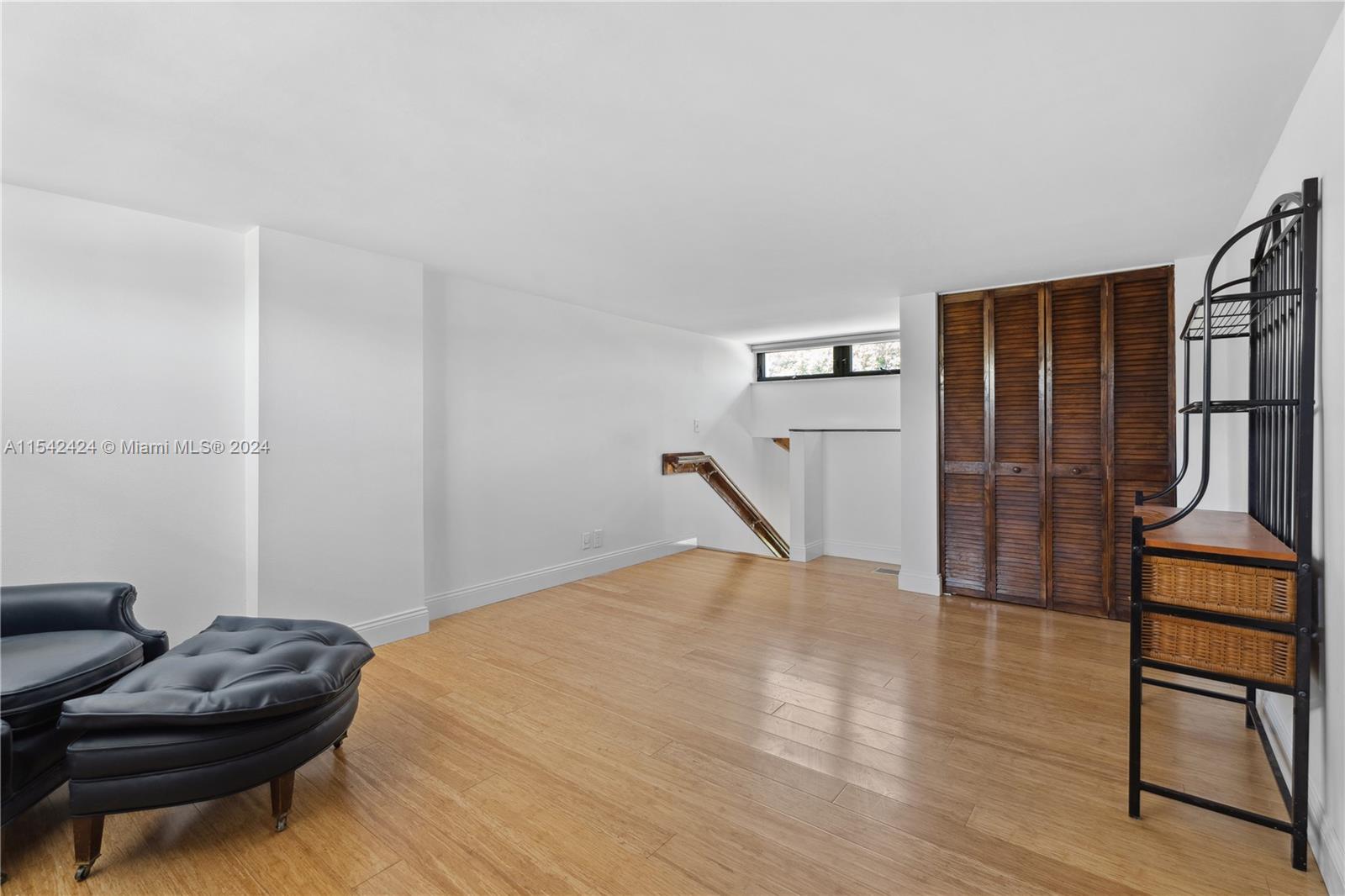 2nd floor hallway  between bedrooms has laundry center