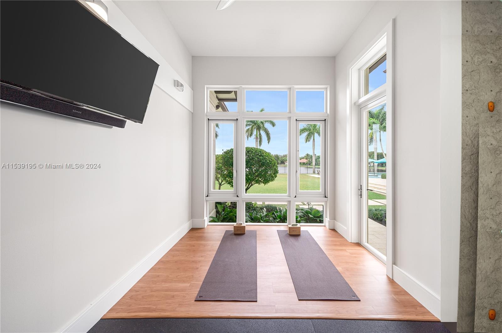 Gym space with digital rendering of rock climbing wall.