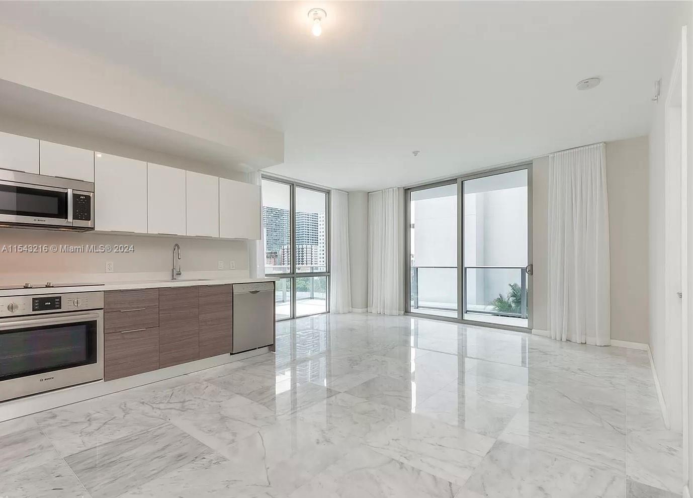 Brickell Ten Condo: Modern living in this 2017-built, 1273 SqFt corner unit. 
Features 3 bedrooms, 1 enclosed DEN, 2 assigned garage parking spaces, and 1 storage unit. It’s vacant and move-in ready: freshly painted, marble floors restored and polished. Easy to show! Contact me for showings and video.  
Enjoy a spacious 285.6 SqFt wrap-around terrace, open layout with 9’ ceilings, and floor-to-ceiling sliding glass doors. Italian kitchen with quartz countertops, Bosch appliances, and in-unit washer/dryer. 
Amenities include rooftop gym, barbecue, 1600 sq ft pool, and social club with billiard on the 5th floor. Located just 1 block from Publix and 2 blocks from City Centre. Perfectly positioned for convenience and luxury