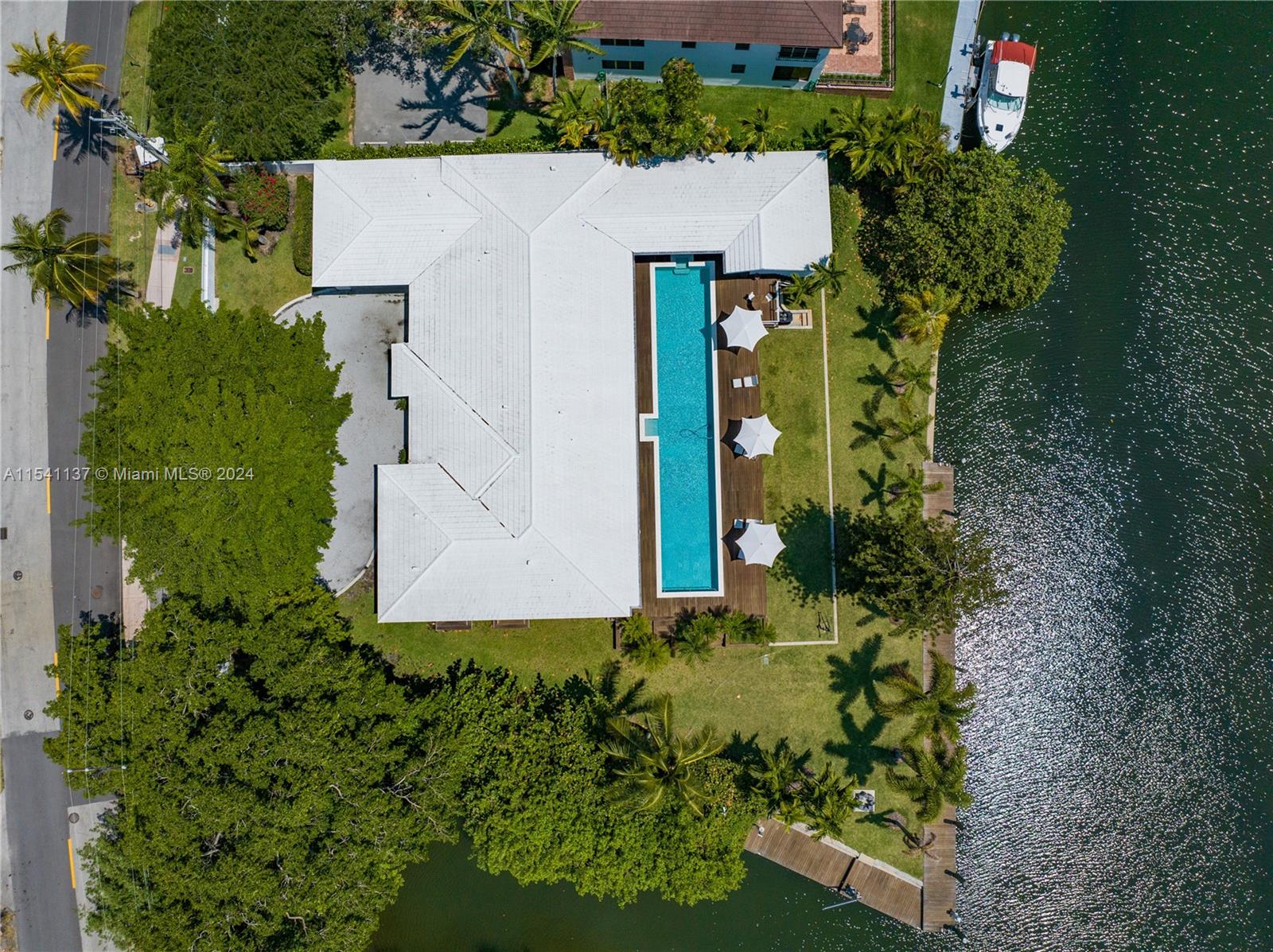 Coral Gables Waterway Gem, Renovated. Actual Living Space 4,817 and 22,000 Lot as per Plans. Wide Canal, 100’ Dock facing North, 40' Dock East, dock 2013 renovated. This is a dream home for any Angler. Bridge clearance 18' Height, 15 min. to Intercoastal. A renovated home using the most selective materials such as Onyx, Quartz, Exquisite Marble, European Hardware, Quartz Counter tops. Kitchen is for the Chef in mind, 4 Thermador Column Style Refrigerators, Freezer, Wine station, 2 Separate Sink Stations, and Cooking Surfaces, Ovens. Service quarters next to kitchen. Adjacent to kitchen, a Chef Table, seats 10. This 6 Bedrooms, 6 1/2 Bathrooms, and Office has a Grand Room and most Bedrooms face the Waterways and the 75’ Pool. Impact windows and doors.