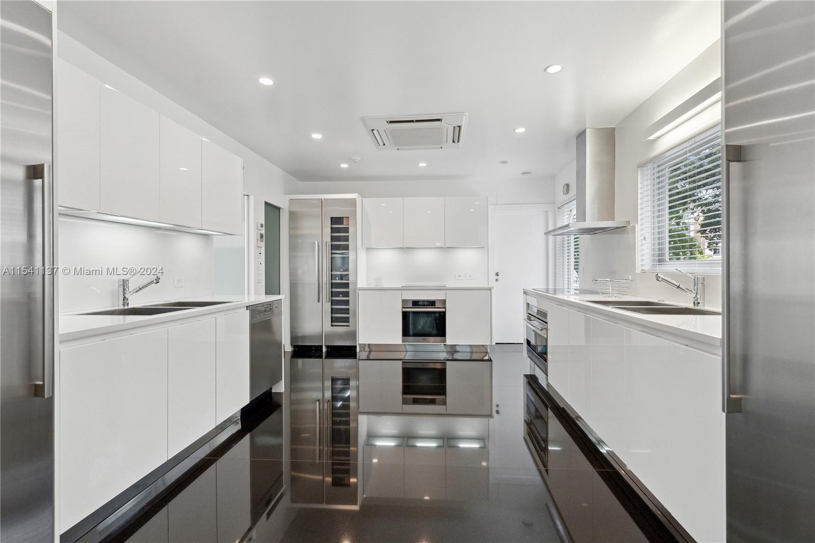 Double Sink, Double Cooking Station, 4 Thermador Column Refrigerator and Wine Station