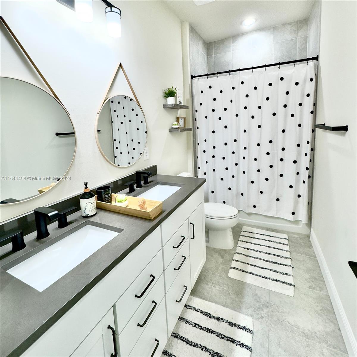 Guest bath with double vanity sink and tub