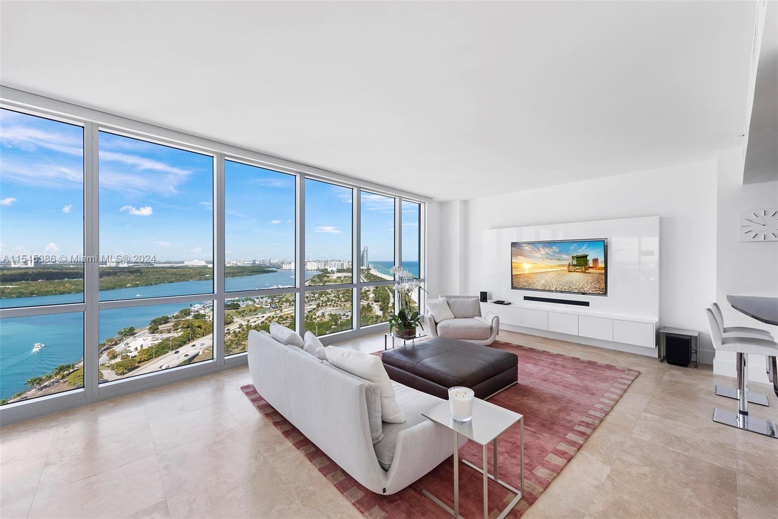 Stunning high-floor corner residence with private elevator and floor-to-ceiling windows. Enjoy breathtaking
unobstructed views of the intracoastal inlet, the ocean coastline, and the Miami skyline from an impressive terrace.
Residence 2404, located one floor below the penthouses, features a state-of-the-art kitchen with Poggenpohl
cabinetry, fully-appointed bathrooms featuring the finest fixtures. Residents enjoy full access to Ritz Carlton resort
amenities such as ocean and poolside service and an on-site restaurant and spa. Located minutes from Miami
Beach’s finest shopping and dining destinations.