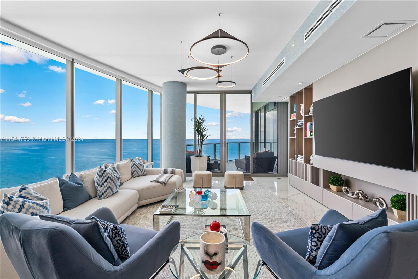 This luxurious residence at the Ritz Carlton in Sunny Isles features three generous bedrooms and four bathrooms, with the direct elevator leading to the private foyer, all complemented by stunning views of the ocean and city. The kitchen has been thoughtfully redesigned to maximize the enjoyment of the scenic views, making this floorplan unique. The residence comes fully equipped with high-end appliances, a cappuccino maker, wine cooler, 10-ft ceilings, and Snaidero kitchen cabinetry. Experience breathtaking panoramic views of the sunrise and sunset from two separate terraces. Exclusive amenities for residents include a sky lounge, two swimming pools, a fitness center, guest suites, a restaurant, beach service, and 250 linear feet of beachfront.