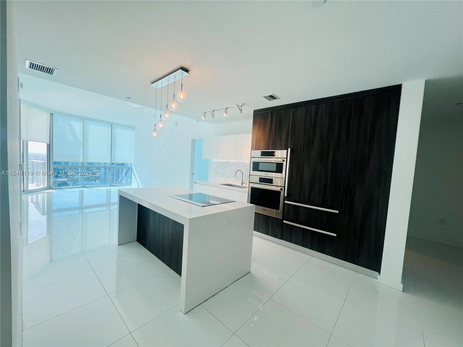 BEAUTIFUL 2BD+HUGE DEN W/CLOSET THAT CAN BE A 3rd BED, 3 BATHS CONDO AT LUXURY PARAMOUNT MIAMI WORLD CENTER. OVER SIZED BALCONY OVERLOOKING MIAMI SKYLINE, PRIVATE ELEVATOR. WALKING DISTANCE TO VIRGIN TRAIN STATION, METRO MOVER, BAYSIDE, PORT OF MIAMI, KASEYA CENTER, ART MUSEUM. SHORT DRIVE TO MIAMI INT'L AIRPORT, BRICKELL, WYNWOOD AND MIAMI BEACH. HOA INCLUDES INTERNET AND CABLE, WATER, AND TRASH REMOVAL. ONE ASSIGNED PARKING SPACE AND ONE COMPLIMENTARY VALET. PLENTY OF LUXURY AMENITIES AND SERVICES. FIVE POOLS, BASKETBALL COURT, BOXING COURT, RACQUETBALL, YOGA, SAUNA, SPA, ULTIMATE GYM, BBQ KITCHEN, VIRTUAL GOLF, RECORDING STUDIO, KIDS PLAY AREA.  SOCCER FIELD, TENNIS COURT, SKY DECK, OBSERVATORY. JACUZZI ON 53rd FLOOR OVERLOOKING MIAMI SKYLINE. 24 HRS CONCIERGE, VALET PARKING, SECURITY.