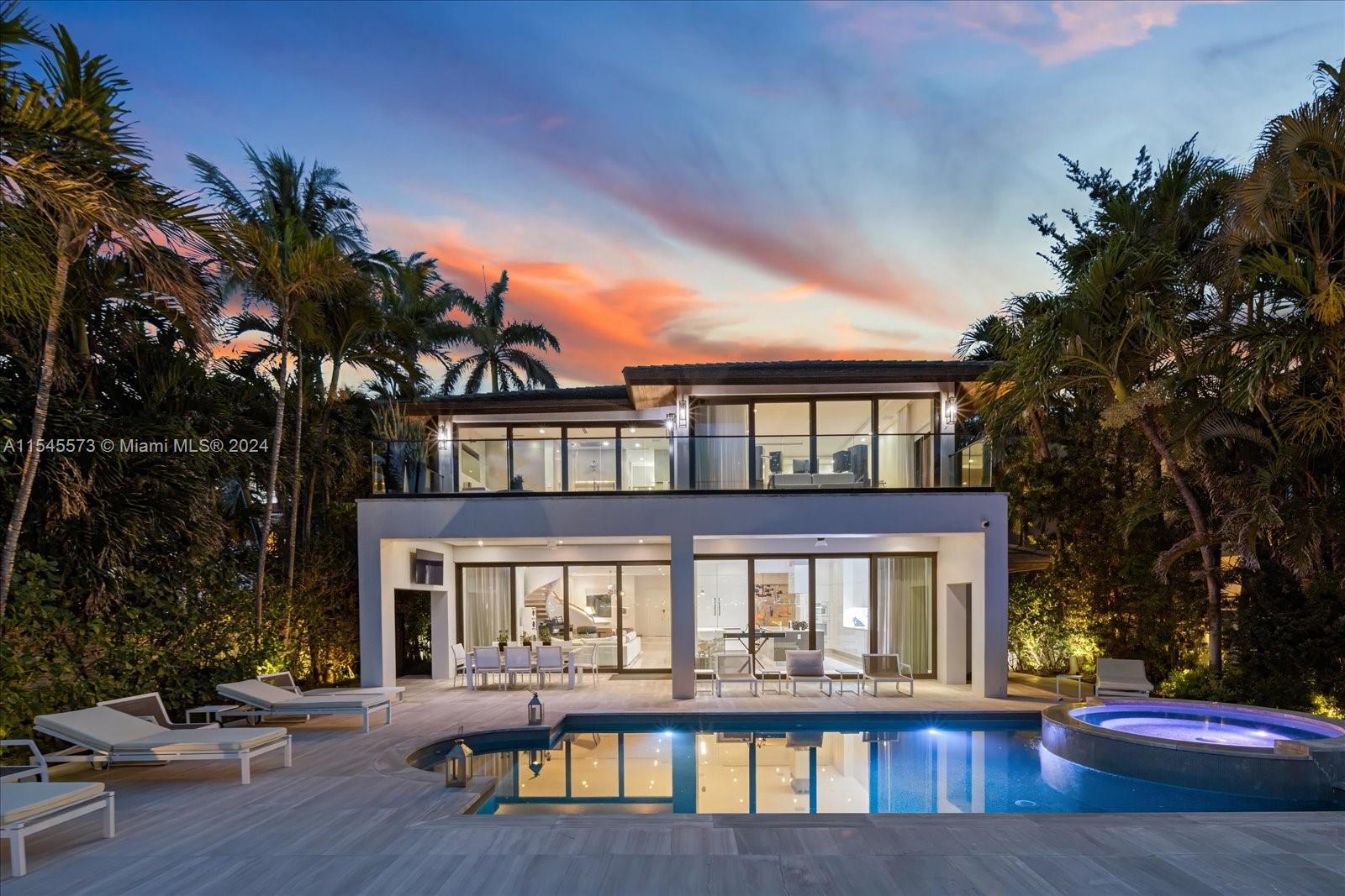 Lush tropical landscaping envelops this exquisite contemporary waterfront residence with mesmerizing vistas of Miami Beach from its expansive floor-to-ceiling telescopic sliding glass doors. Featuring 7 bedrooms, 7.5 bathrooms, an elegant Italian kitchen, Miele/SubZero appliances, luxurious Dornbracht bath fixtures, and a cutting-edge Lutron lighting/Savant automated Smart system. Immerse yourself in tranquility and seclusion as you step into the home's picturesque courtyard entrance and then walk thru the open plan home to the spacious outdoor with wide bay water views. Experience the ultimate Miami lifestyle as you are walking distance to Sunset Harbor, and minutes from Design District and downtown with prestigious shopping, fine dining and nightlife.