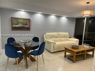 lLiving and dining iluminated spaciuos area