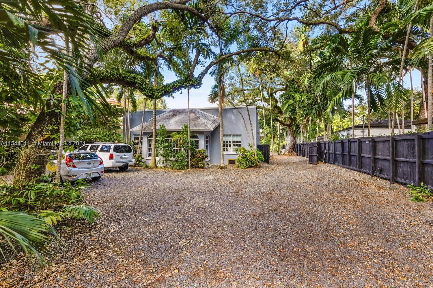 Live the Grove lifestyle on a captivating, tree-canopied North Grove street - just a short walk or bike ride to bayfront parks & marinas. Classic 1920’s home with 4BR/2.5BA. Expansive, one-half acre lot (21,600 SF). Freestanding 2-story garage has been converted into 3 living units that are in need of repair & renovation. Not in a flood zone (one of the highest sea-level elevations in South Florida) and close to the historic Grove village’s trendy galleries, boutiques & cafes. Also, ideally located just minutes from downtown, MIA, Coral Gables, Key Biscayne & the Beaches. Renovate & expand or build new construction home.