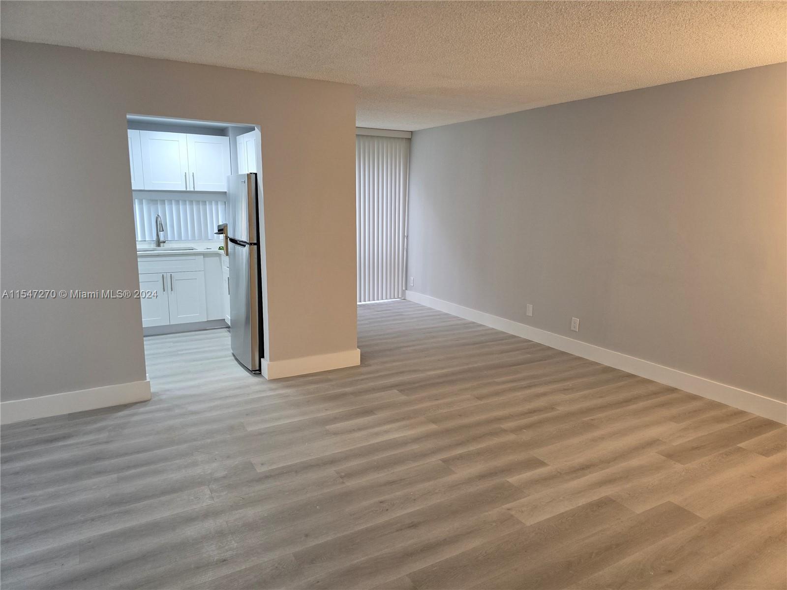 View of Living Room and Dining Room plus Kitchen Entrance