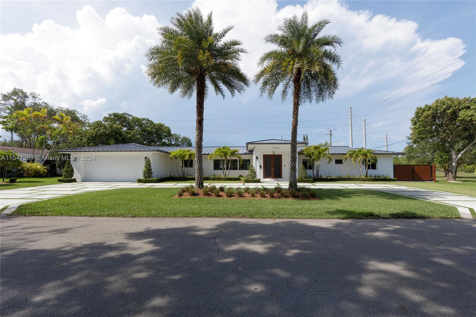 Stunning 5 bdrm/3.5 bath completely remodeled home w/ large addition in late 2021, located in N. Palmetto Bay. Open concept living area, dining rm, chef’s kitchen w/ quartz counters, modern yet warm wood cabinetry, eat-in snack bar, walk-in pantry, all overlooking beautiful views of the backyard. Grand primary suite feat. expansive walk- in closet, luxurious bath w/ wet rm, marble vanity. Ample sized guest rms; one en-suite & jack & jill style bdrms. Indoor laundry rm, mud rm. Smart home w/ surround sound, lighting, security. New roof, PVC plumbing, impact windows/doors. Sprawling, oversized, fenced backyard w/ pool, covered patio & fantastic summer kitchen. 2 car garage, architectural paver driveway & space to park a boat on the side. Near the best schools, Falls shopping, restaurants.