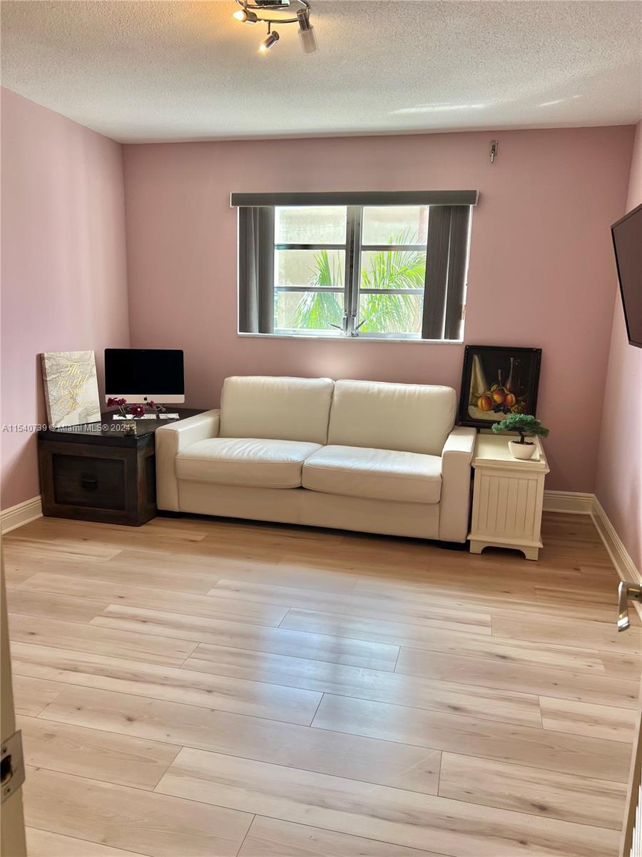 Generous size 2nd bedroom with custom built-in, walk-in closet.
HUrrican shutters.