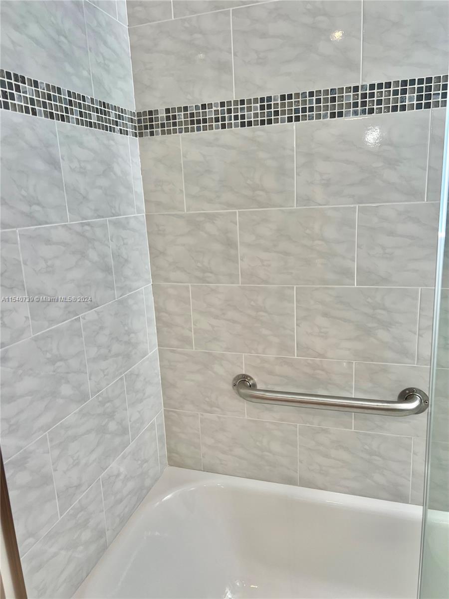 Beautiful tile workmanship and grab bar.