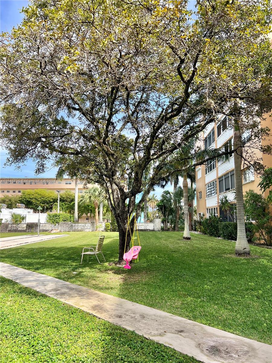 plenty of green space with mature trees and landscaping.