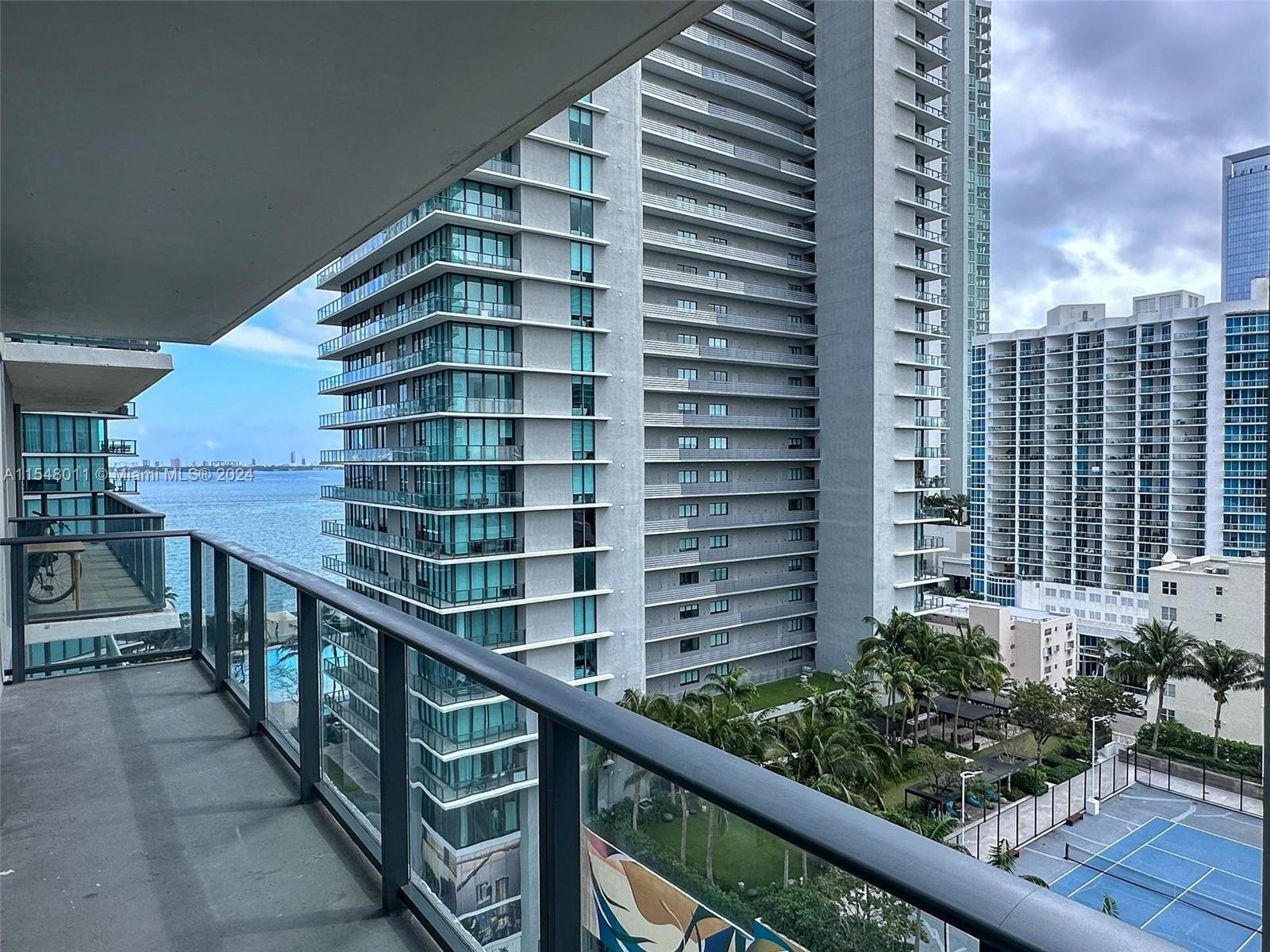 Soak in the SUN-Breathe the Bay & Ocean Water breeze in this Chic Lux 1 Bed 1.5 Bath + DEN, annual RENTAL @Paraiso Bayviews Miami - New Modern White & grey Stone Wash flooring. Lux BOSCH stainless steel appliances. Enjoy your 132 SF Terrace!• Prime location in Miami's Edgewater district - • Energy-efficient, tinted, impact-resistant floor-to-ceiling sliding glass doors • Bay Views to Biscayne Bay & Miami Beach Stunning landmark architecture • Pedestrian-friendly street-front • 24-hour welcome desk with concierge • 24-hour guest valet • 24-hour access control • Resort-Style Rooftop Pool • Luxury Health spa with sauna, steam room • Club room • Complete fitted out gym & spa • Lush landscape w/interactive fountains • Kids Room • Theater Room • Billiards Room • Tennis courts