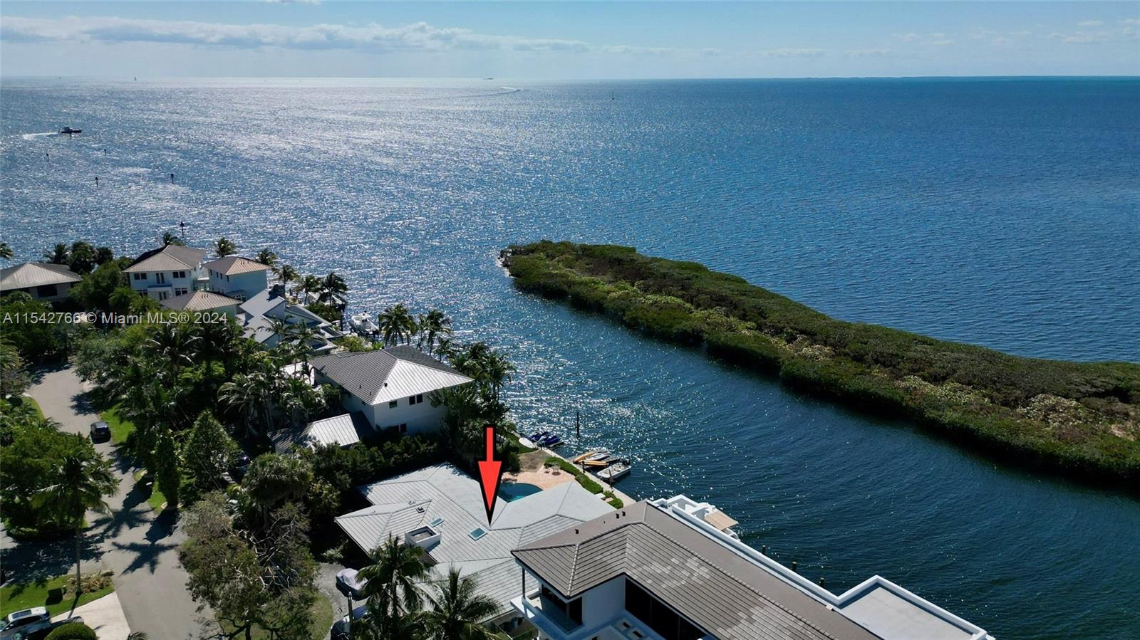 Boater's Paradise! A 12,000 square ft lot with 100 linear ft seawall. Prime location with views of Biscayne Bay which are wide open to the East and visible over a protective hedge of mangroves to the South. From your back door, be out on the bay in seconds. The great room, kitchen, and bedrooms face the water and are bathed in sunlight through panoramic windows which provide amazing views.  This property is move-in ready for the next owner to enjoy the best of Miami waterfront living, but also affords a tremendous opportunity: if redeveloped to the elevation of neighboring homes, this lot will offer endless wide open bay front views.  Either way an incredible investment!