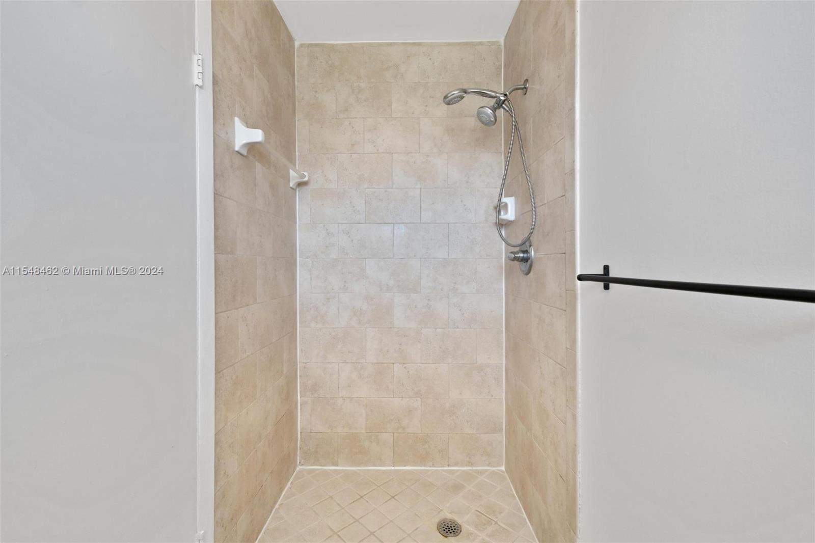 Hallway from master bedroom to the vanity sink on your left and the shower and toilet  Lots of closet space