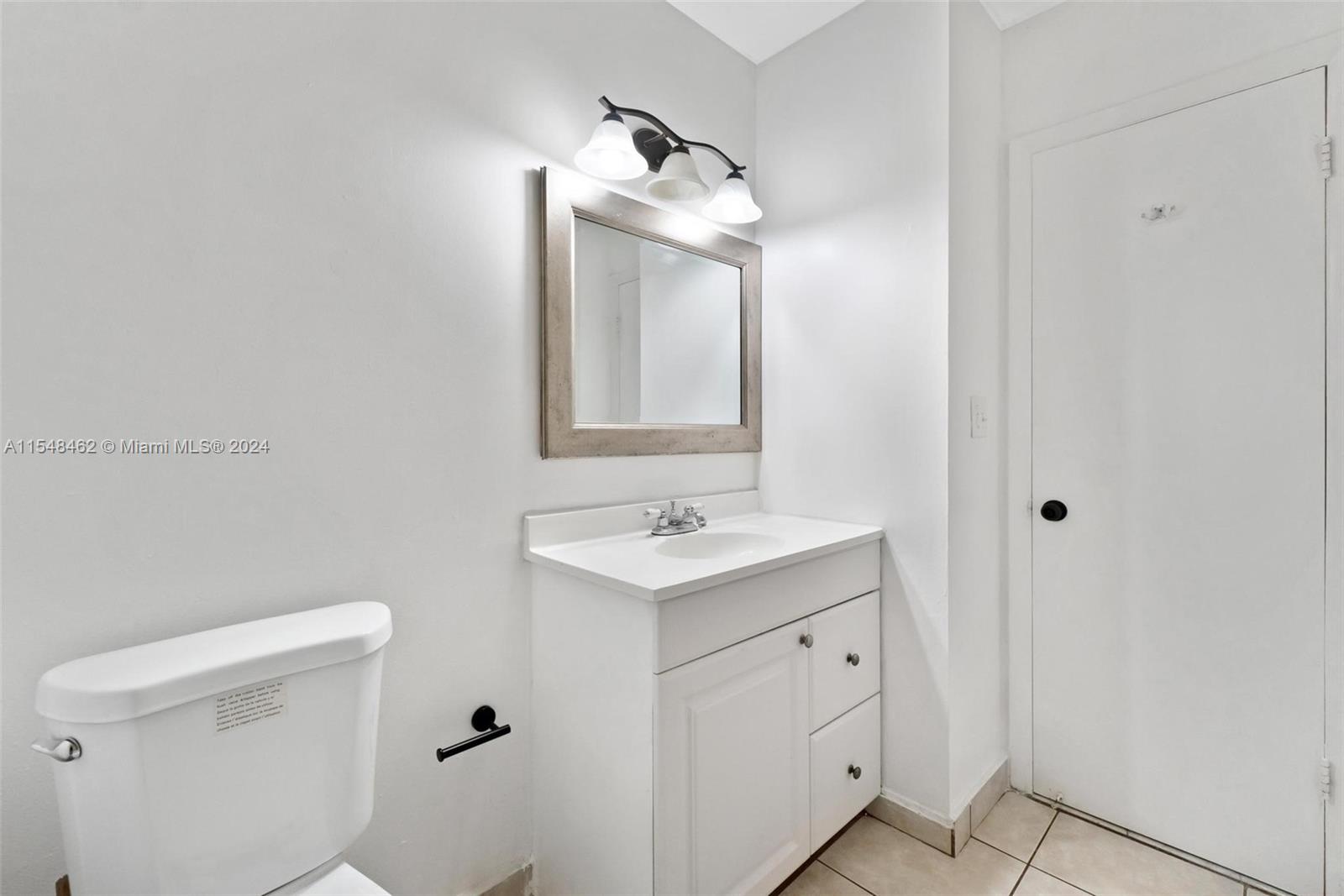 Second bedroom with tile floors