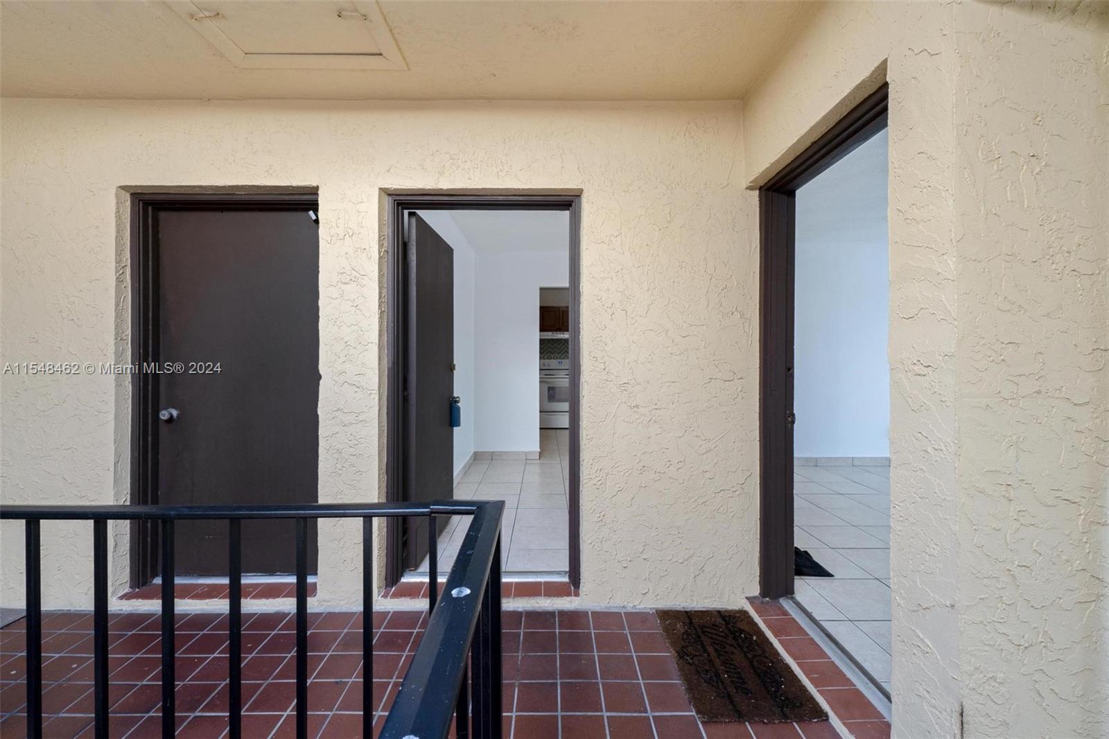 View of second bathroom and hallway to kitchen and then to dining and living area