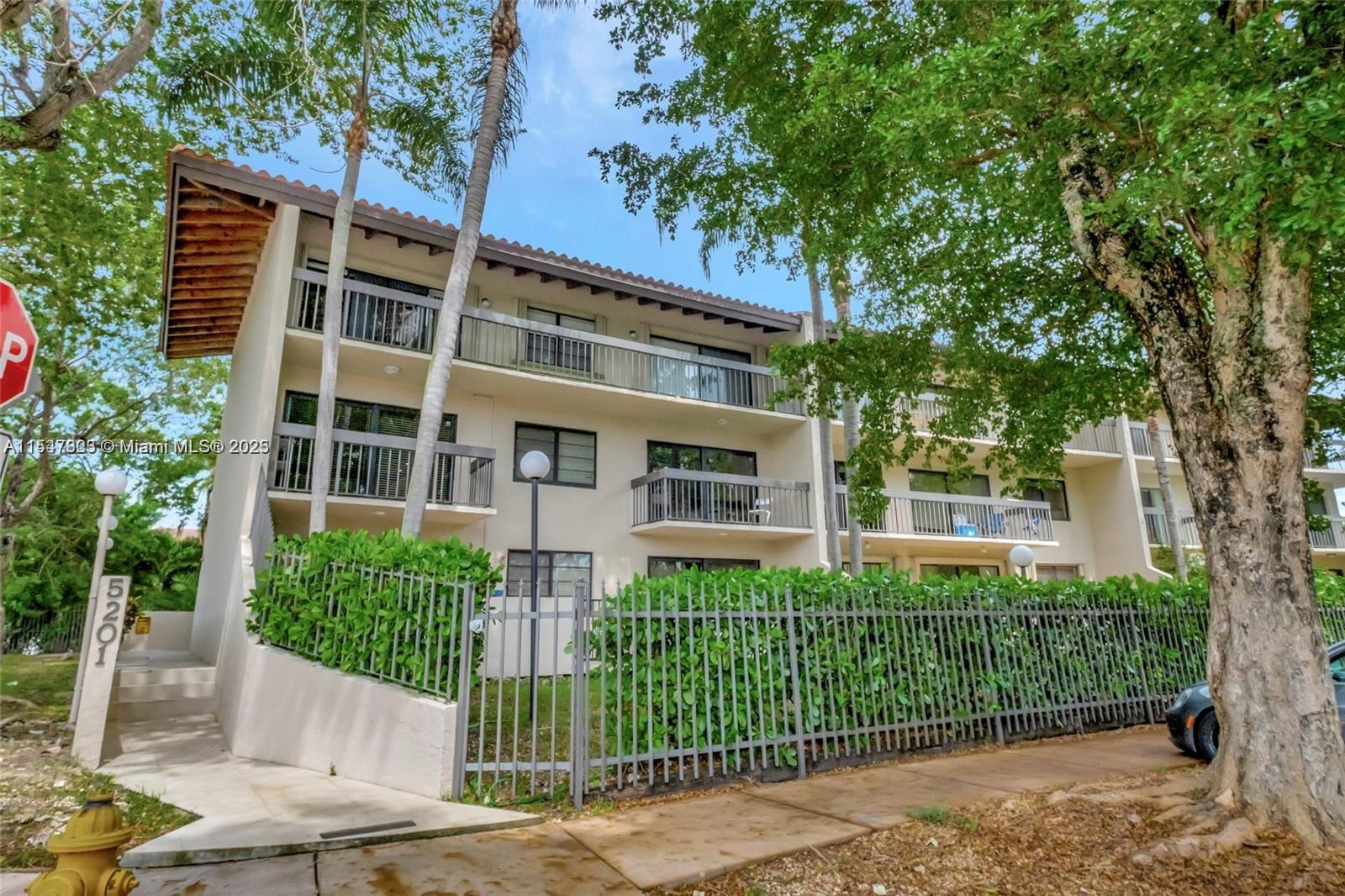 Conveniently positioned on the first floor on this side of the building, the unit offers views of the lush landscape, providing a house-like ambiance