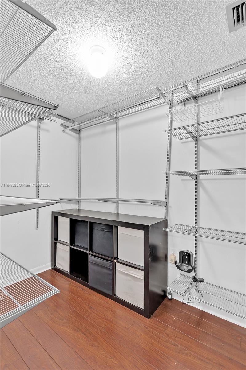 Master bedroom closet, featuring an Elfa closet design that can be easily adjusted and customized to the owner's preferences