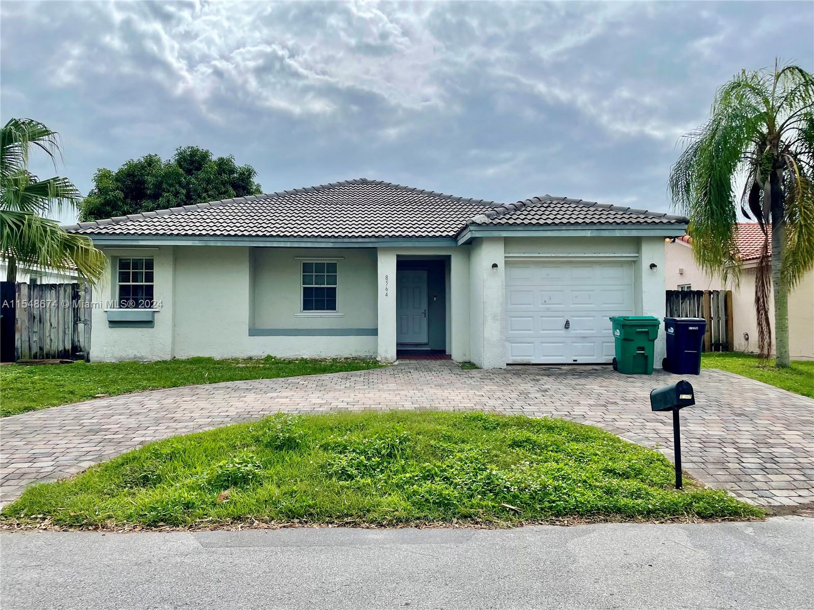 Beautiful and Spacious 3-bedroom and 2-bathroom home nesting in Chantarelle By The Bay in Cutler Bay. The layout is perfect for your family with separate living and a spacious Florida room. As you walk through the home you will notice the spectacular lighting fixtures in every part of the house. The Master Bathroom comes with a jacuzzi for that much-needed relaxing day. Front Yard Maintenance is included in the rent. Rapid Approval, No HOA.